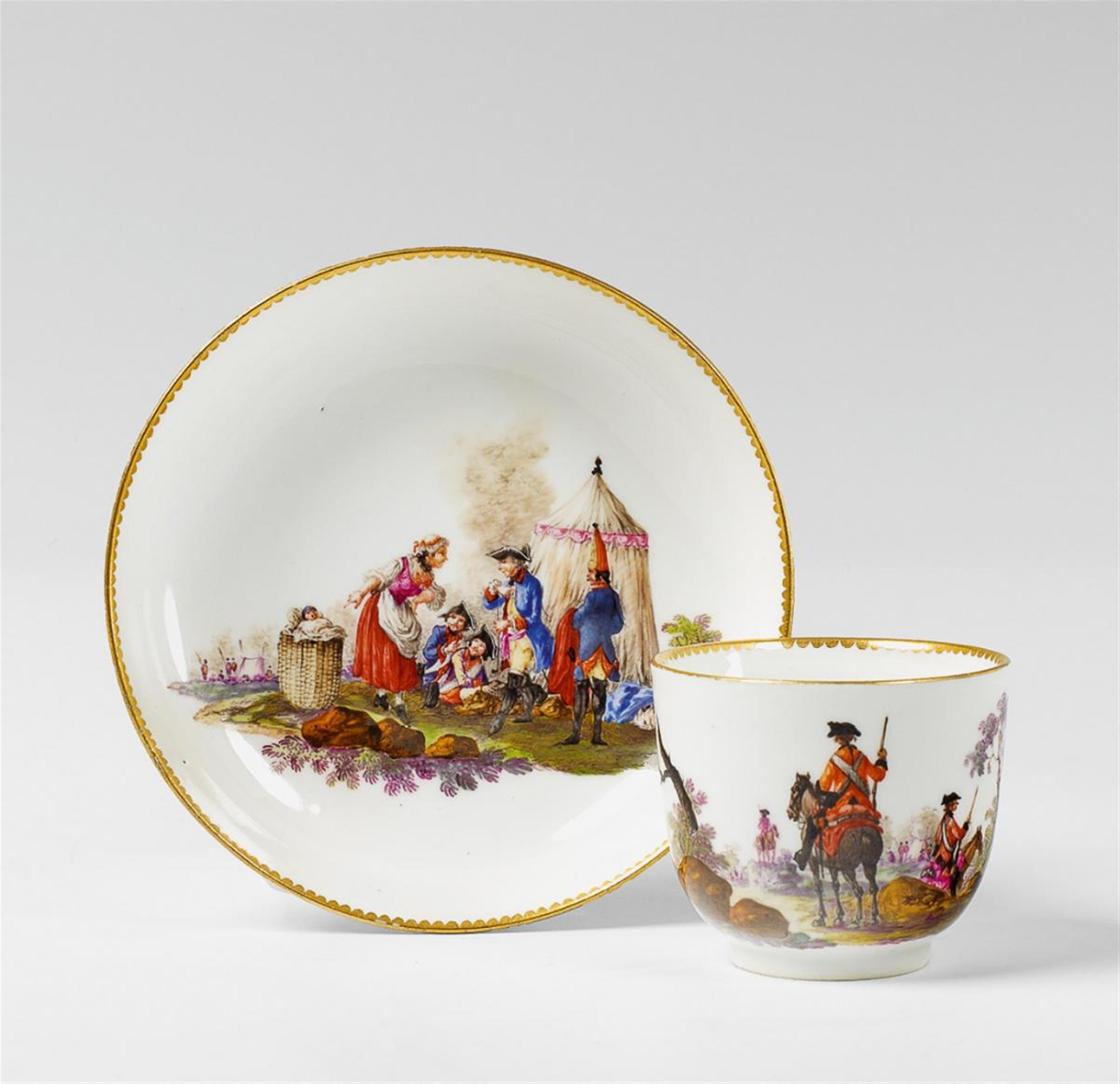 A Meissen coffee cup and saucer with military scenes. - image-1
