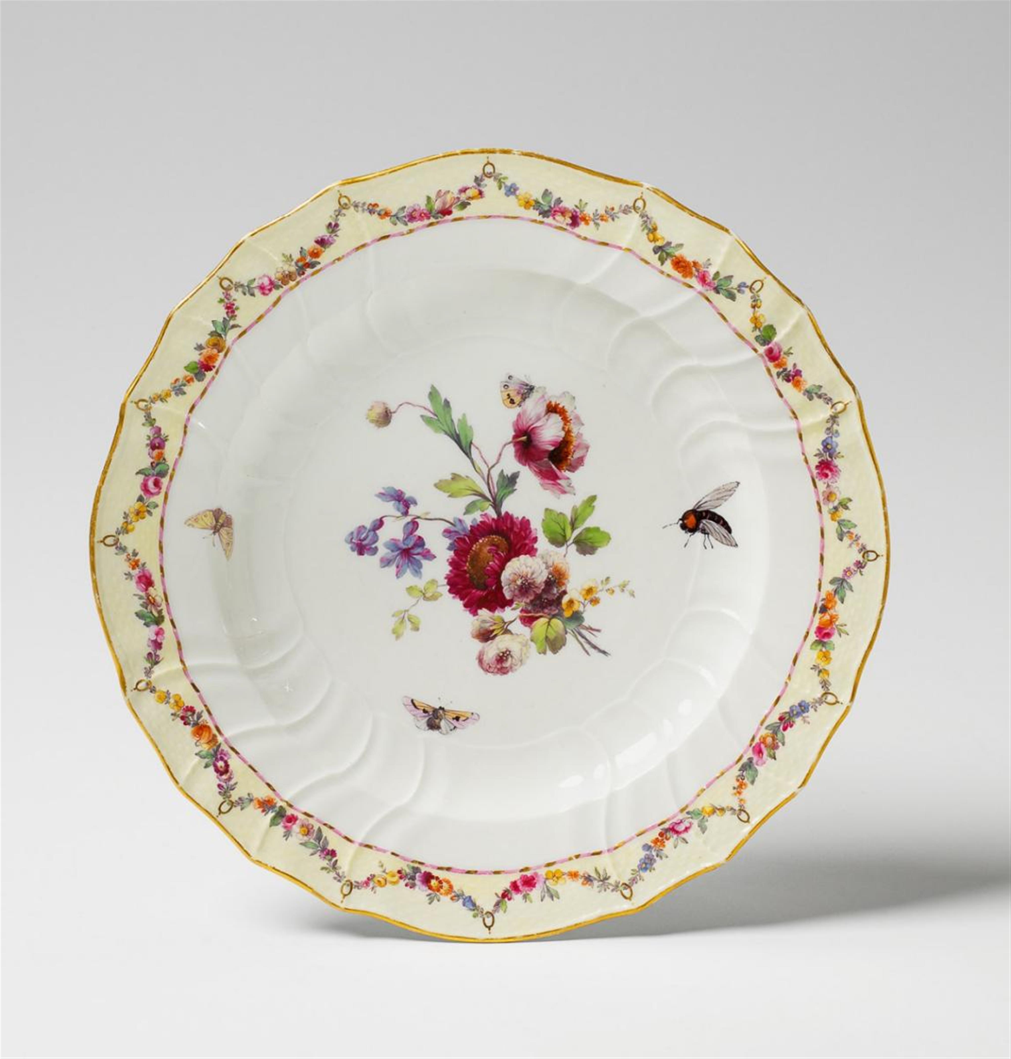 A Berlin KPM neuozier-moulded dinner plate with flower and insect decor. - image-1