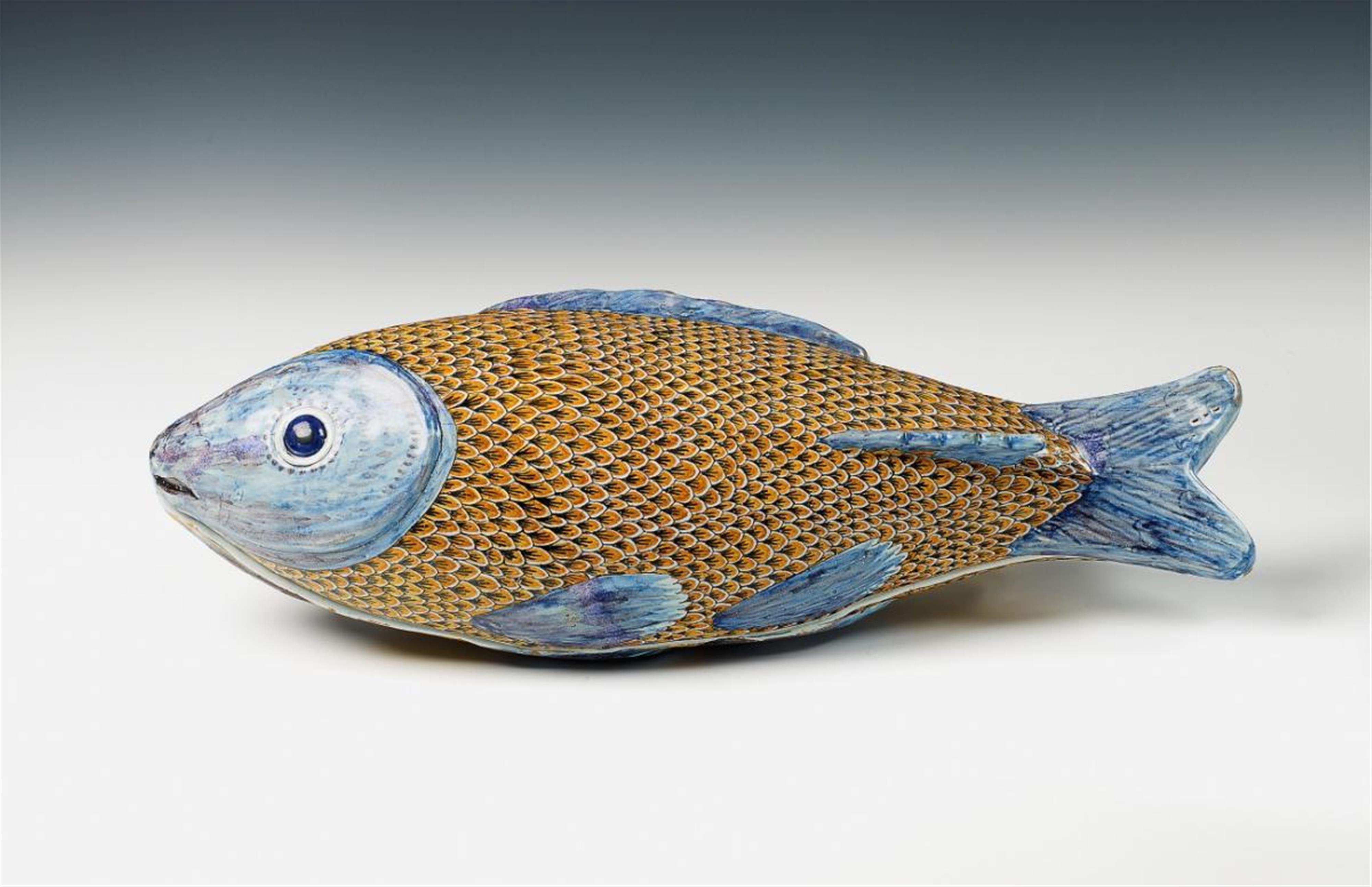 A faience trompe-l'oeil tureen and cover formed as a fish with grand feu decor. - image-1