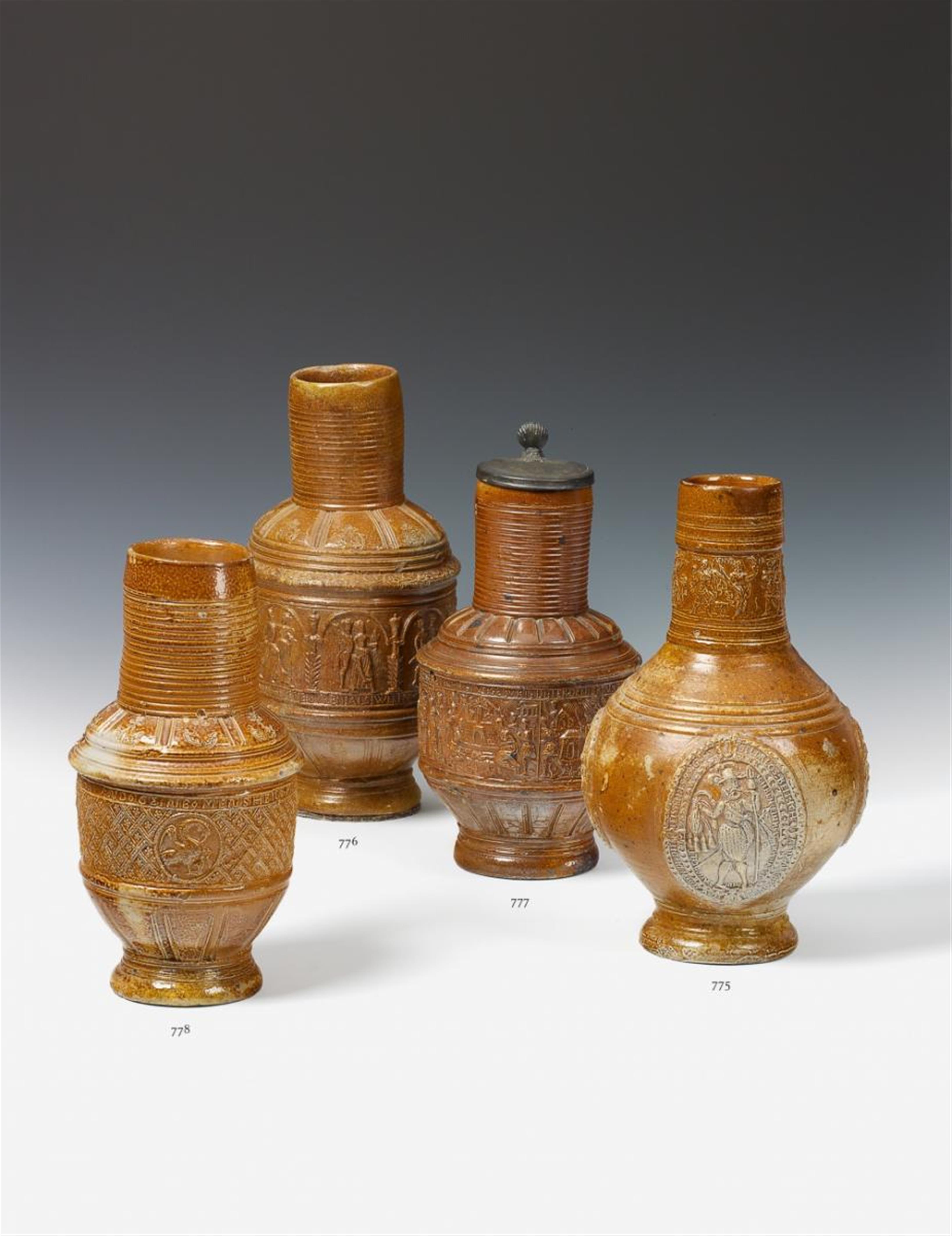 A brown, salt-glazed Raeren stoneware jug made for peasant festivities. - image-1