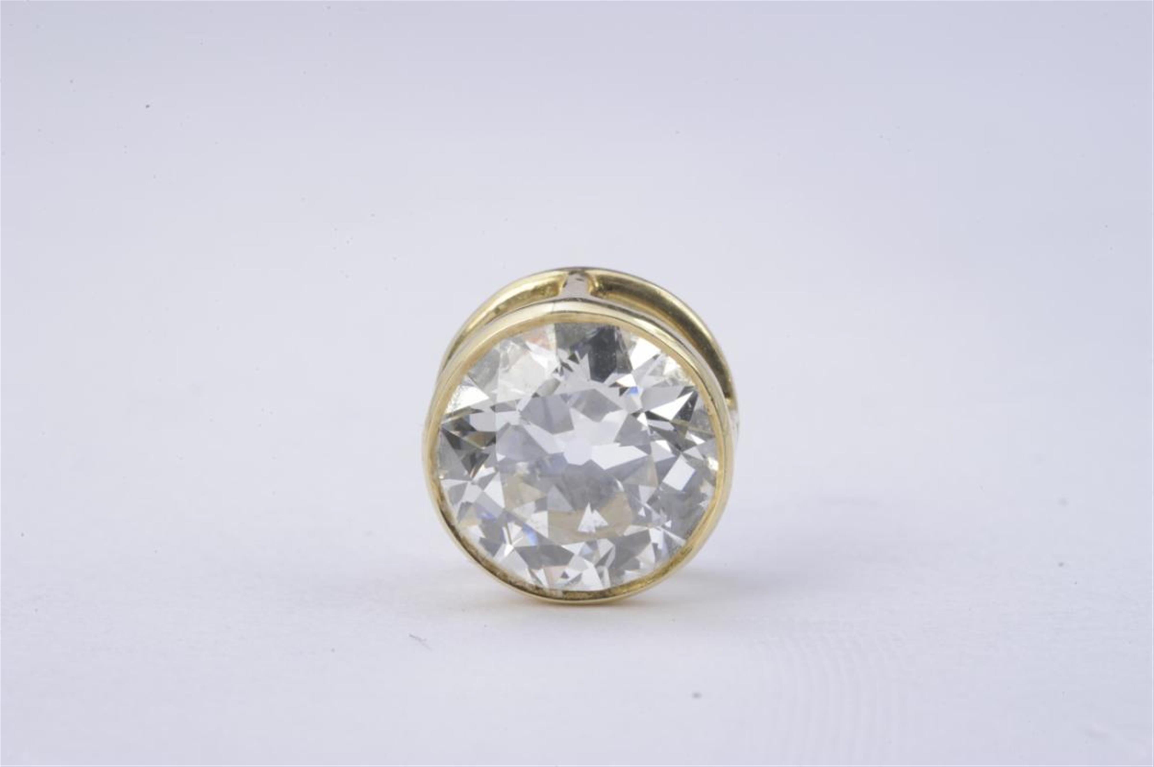 An 18k gold solitaire diamond pendant. - image-1
