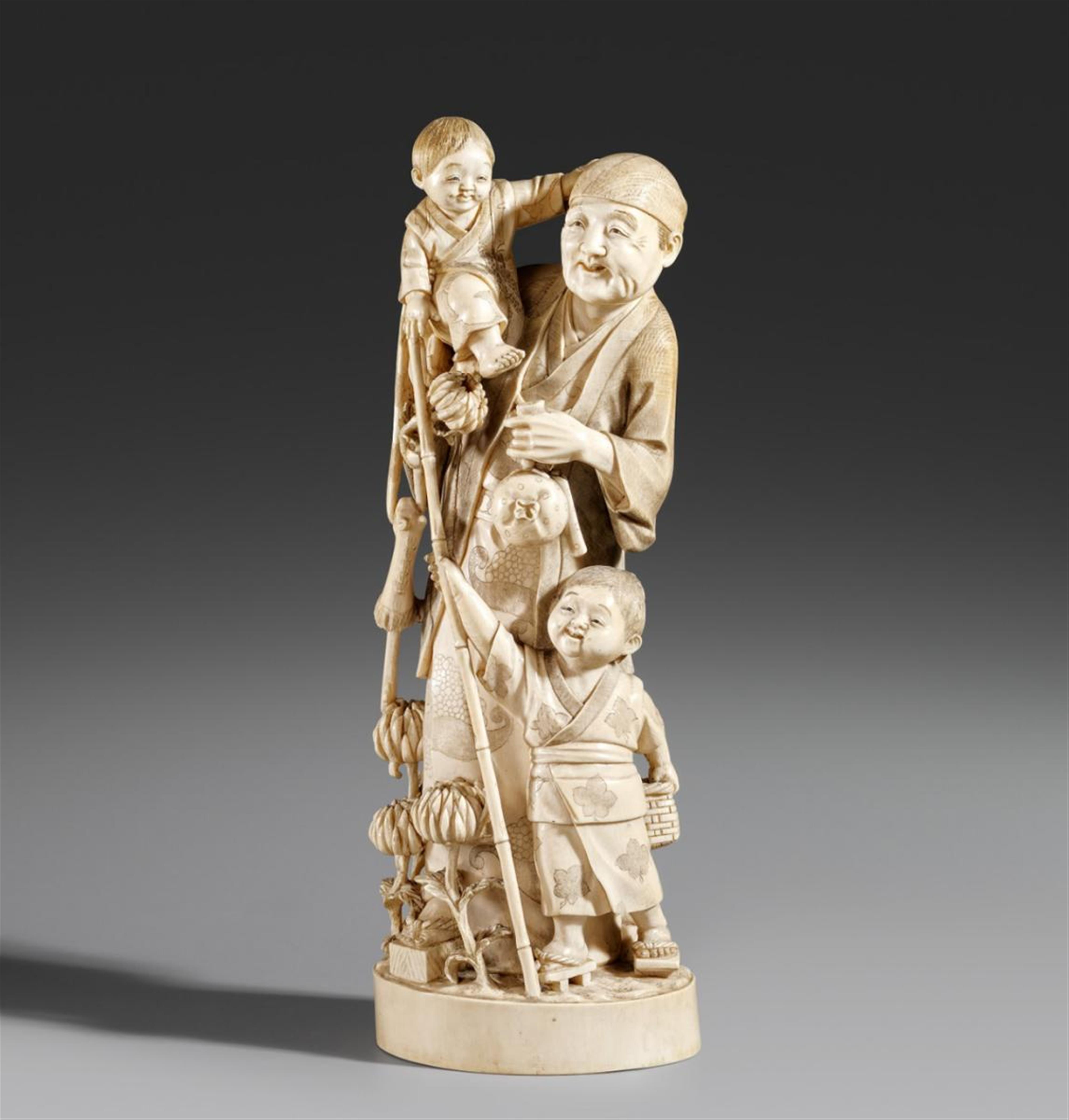A large ivory okimono of a man with two boys. Late 19th century - image-1