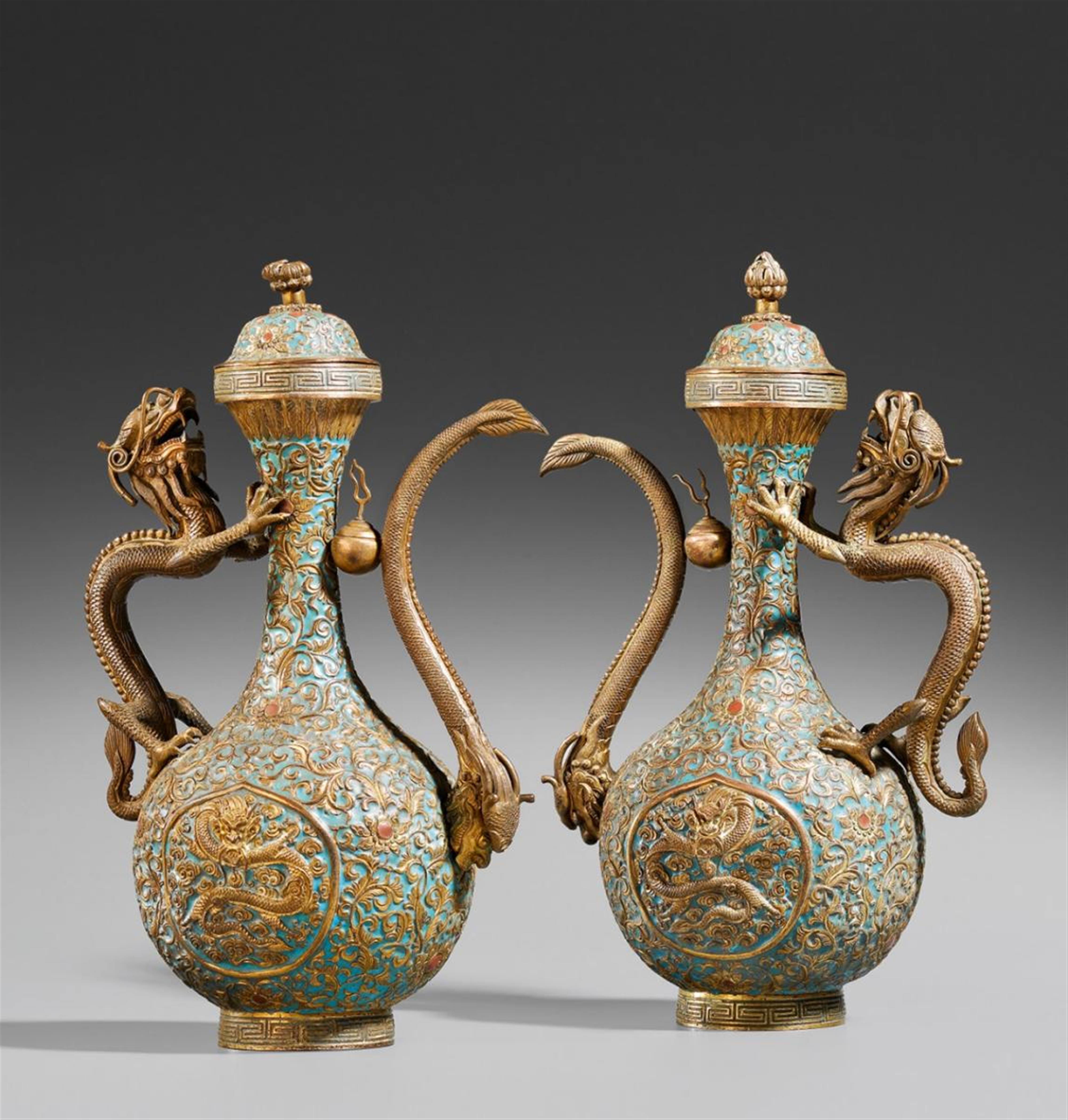 A pair of copper and enamel lidded ewers. Late 19th century - image-1
