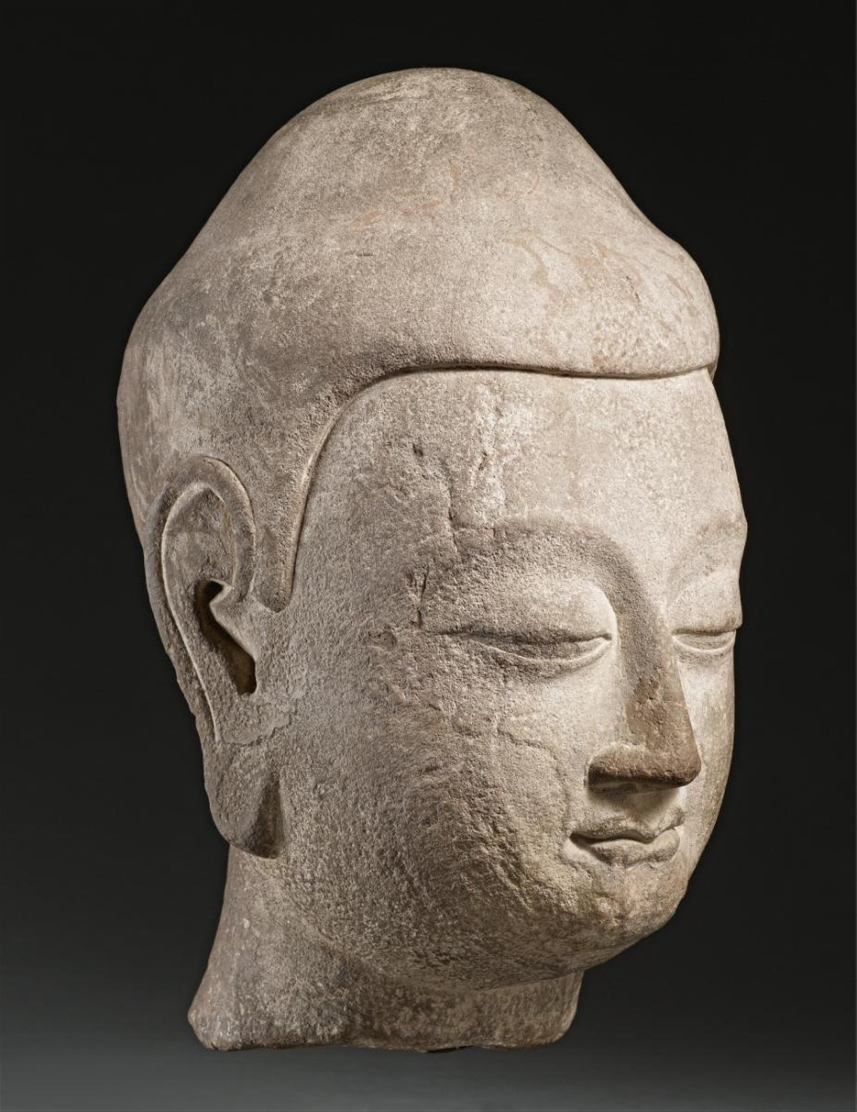 A large limestone head of a Buddha. Northern Qi/early Sui dynasty, 6th century - image-1