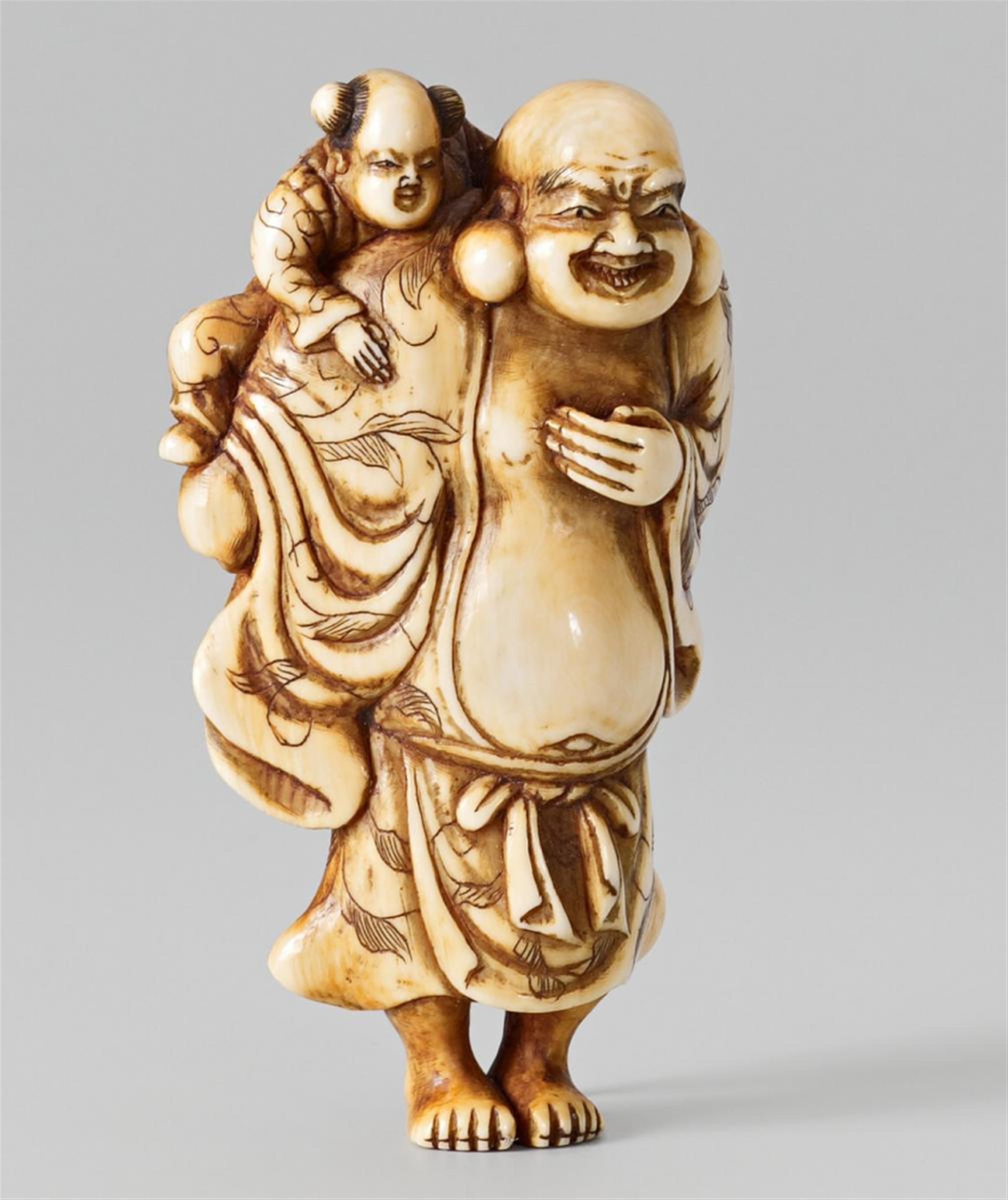 A partly stained ivory netsuke of Hotei carrying a karako. Early 19th century - image-1