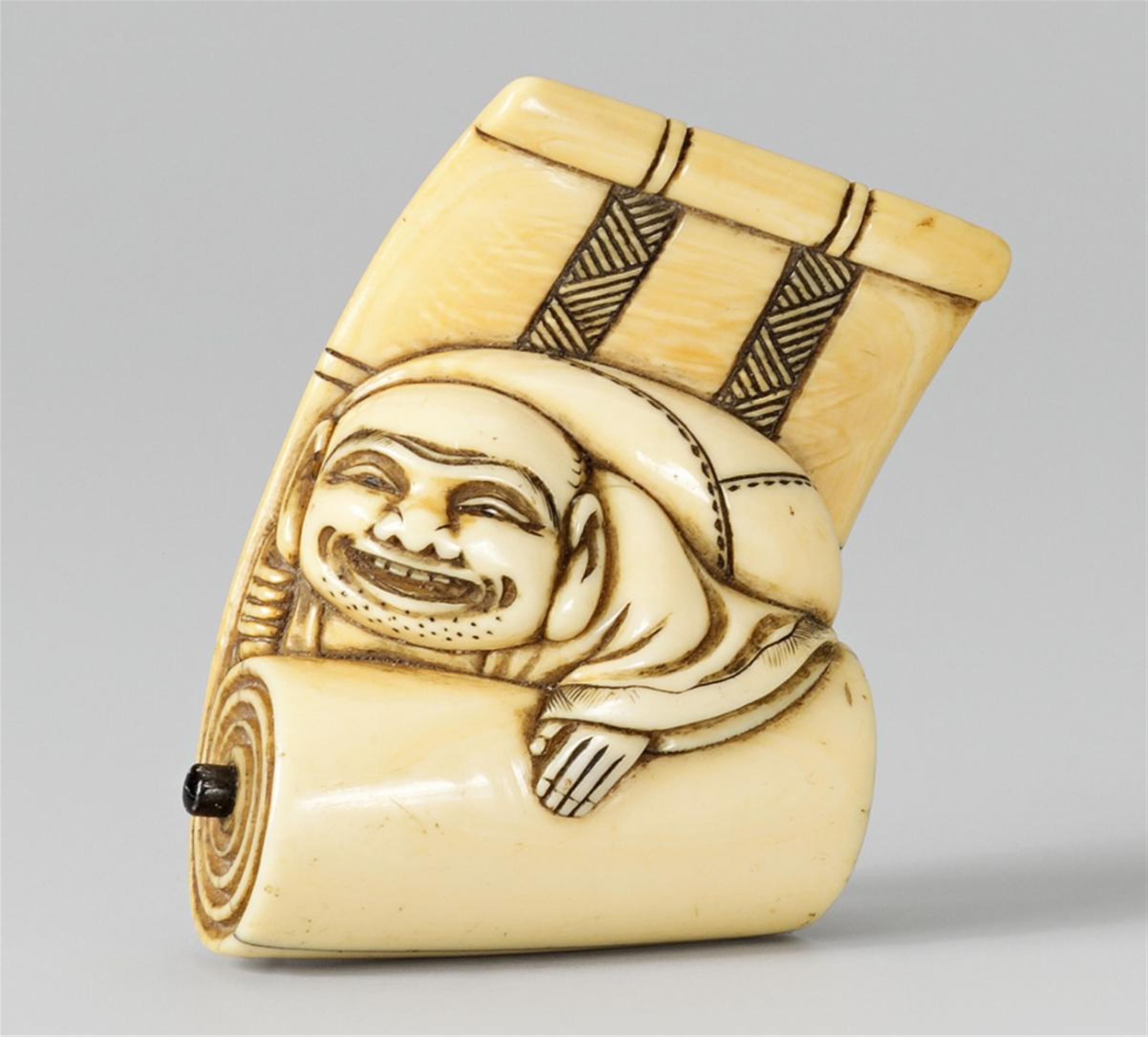 An ivory netsuke of a laughing Hotei emerging from a scroll, by Tomo. First half 19th century - image-1