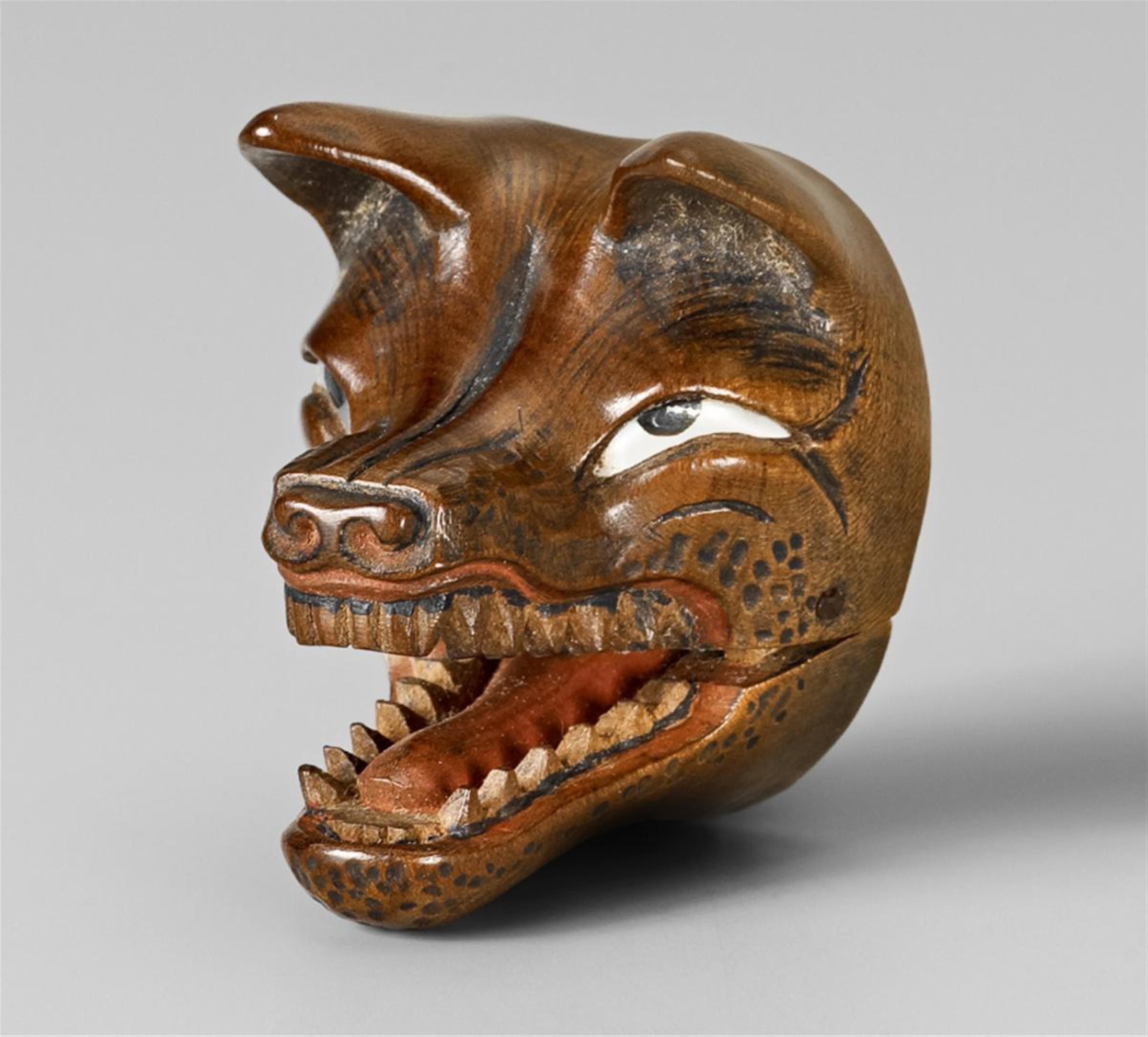 A large wood netsuke of a fierce-looking Kitsune mask. Second half 19th century - image-1