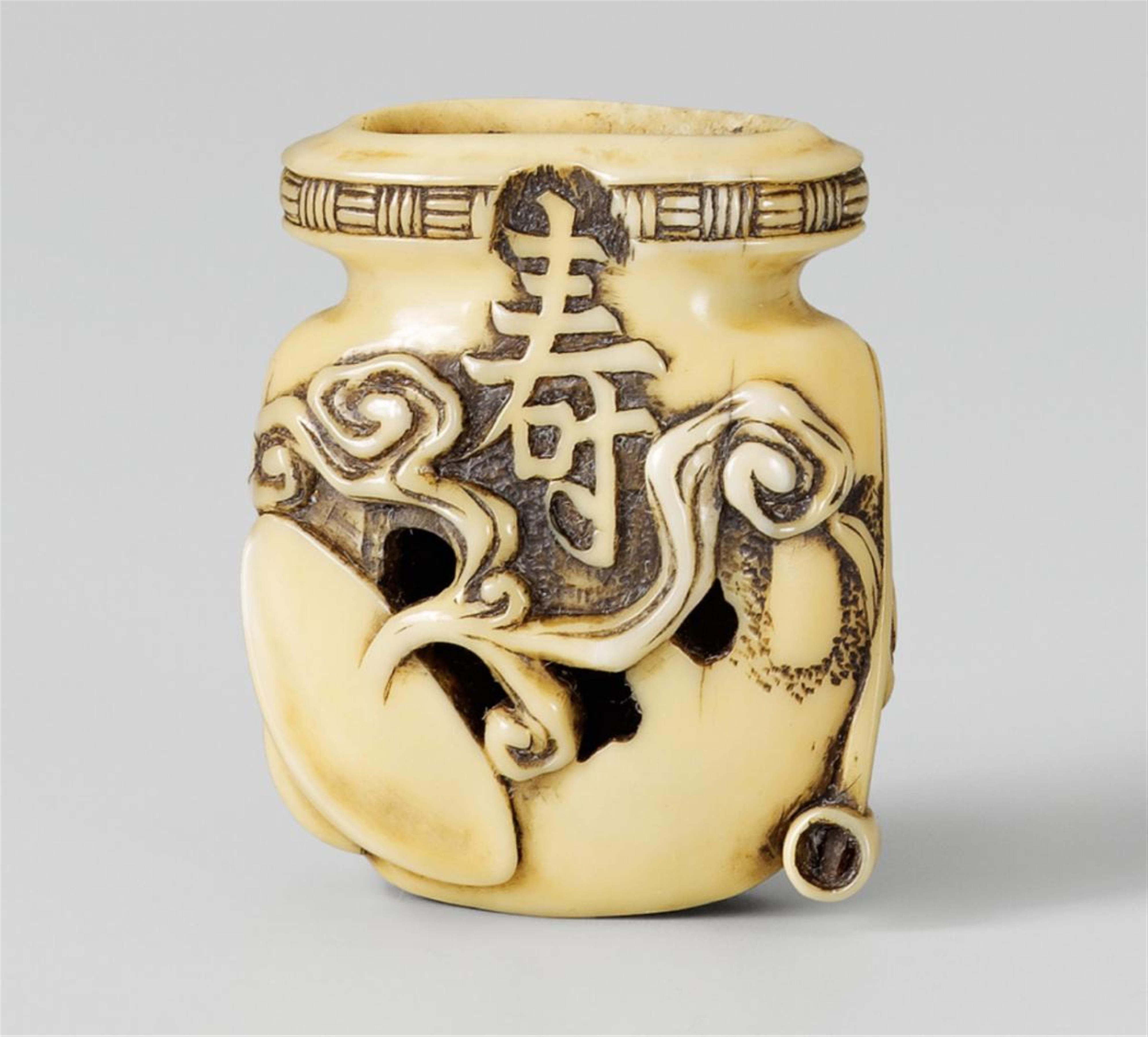 A walrus tusk netsuke of a sake jar with drip glaze. Late 19th century - image-1
