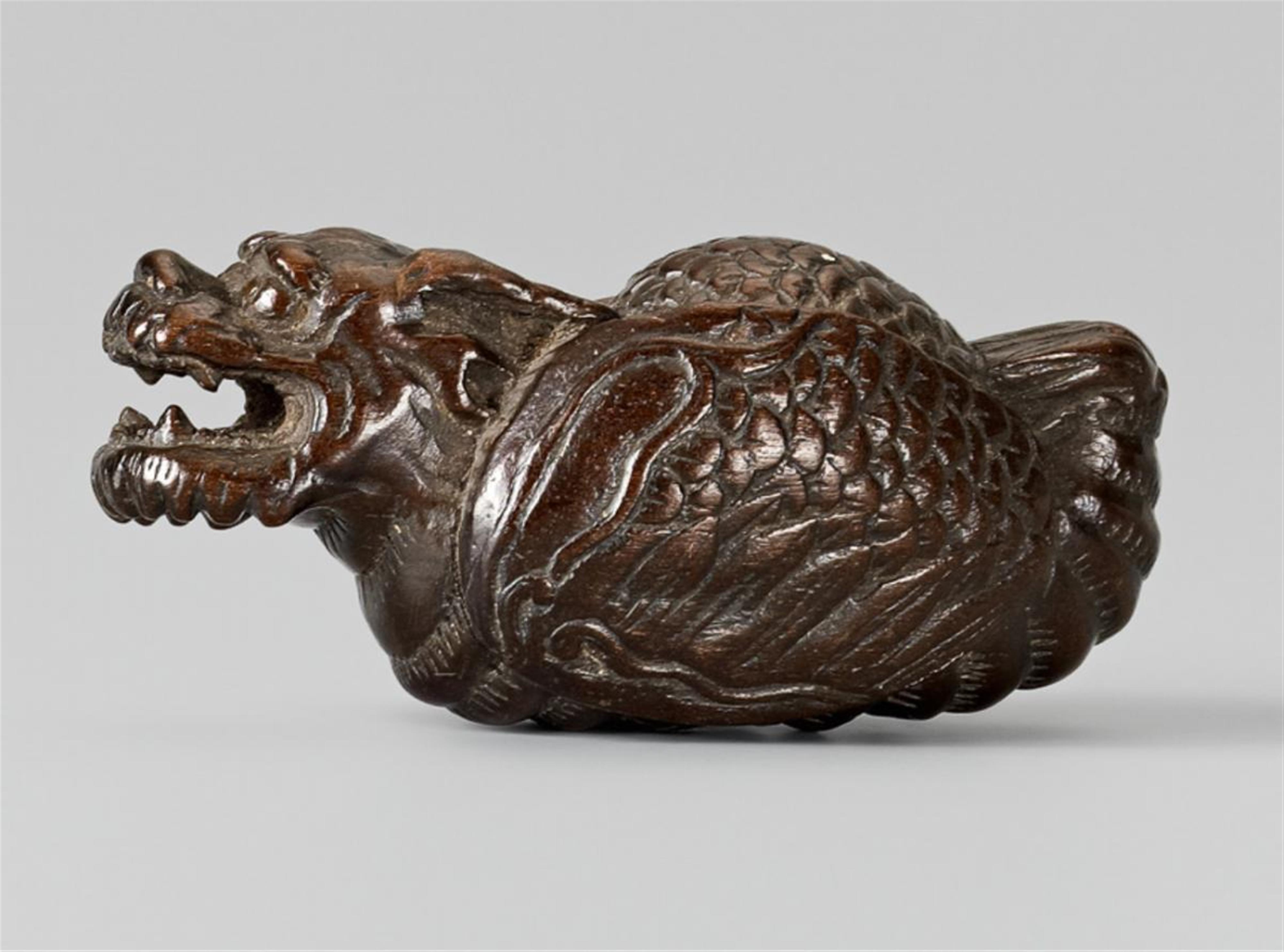 A wood netsuke of a large flying dragon. 19th century - image-1
