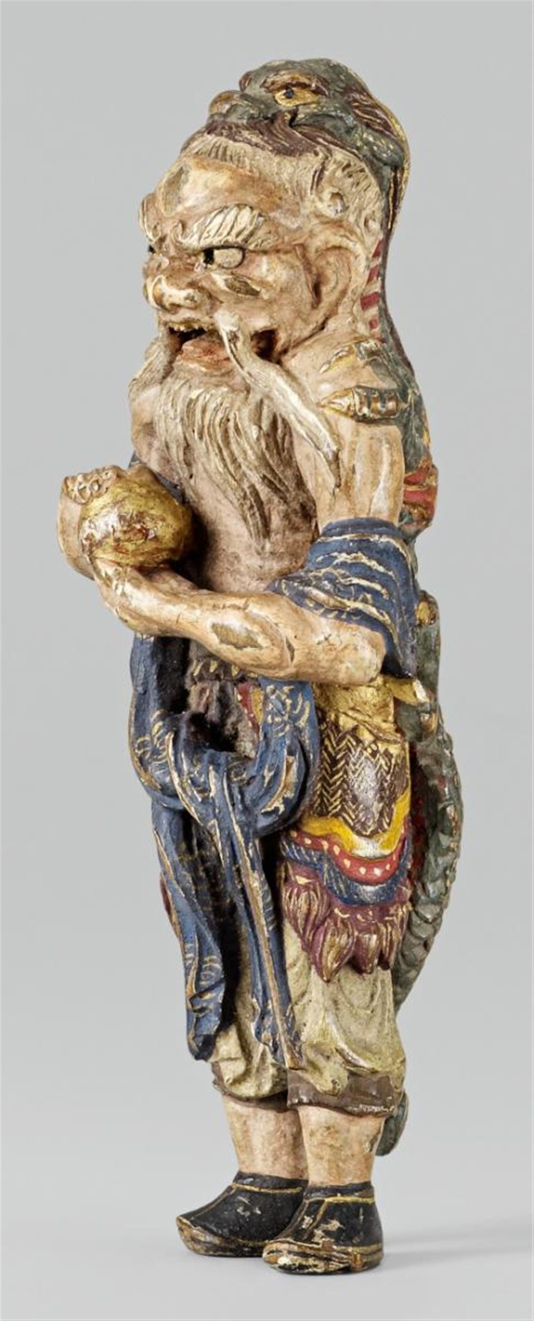 A painted wood netsuke of Ryûjin’s attendant. Late 19th century - image-1