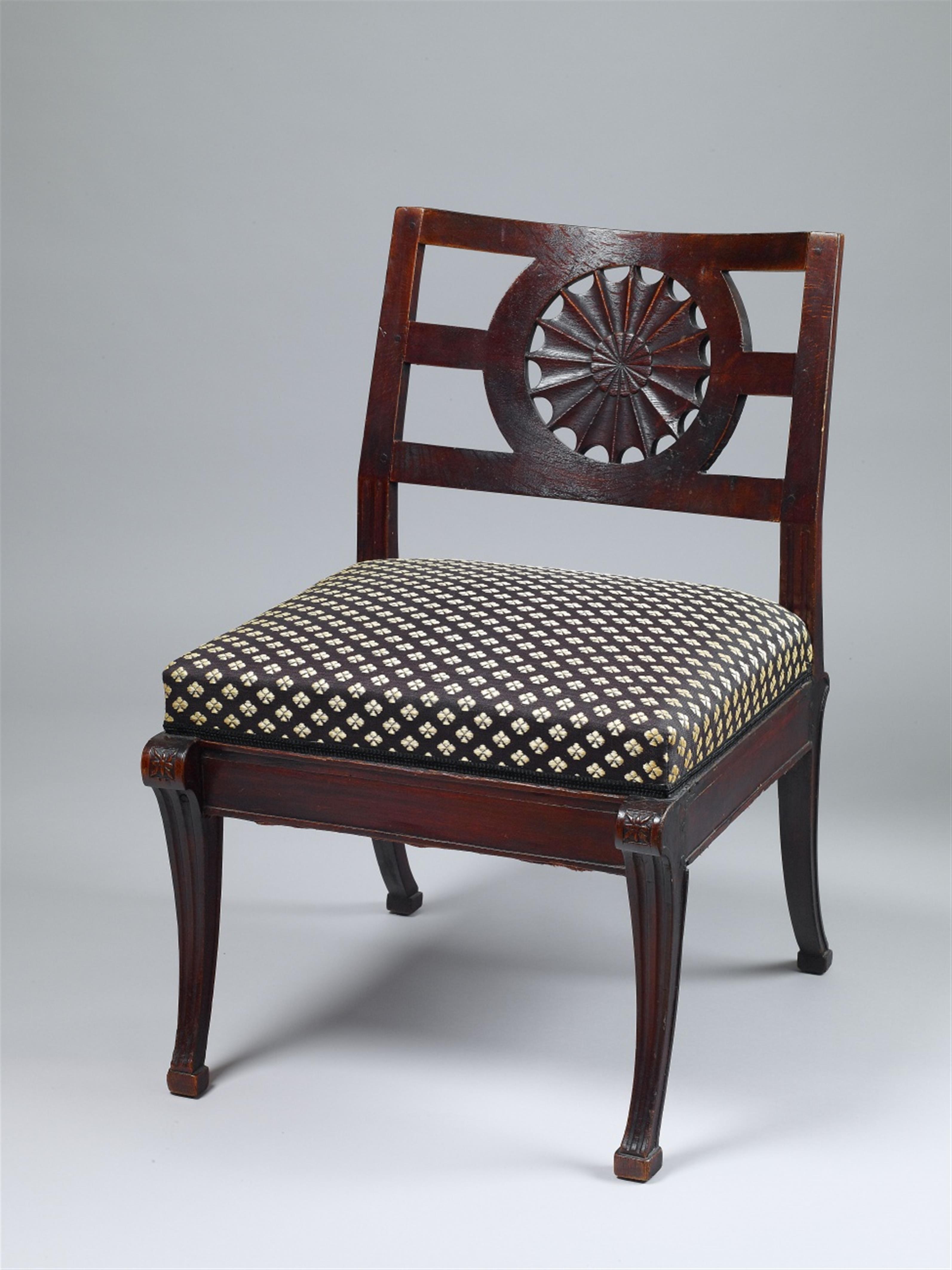 A carved oak upholstered neoclassical chair. - image-1