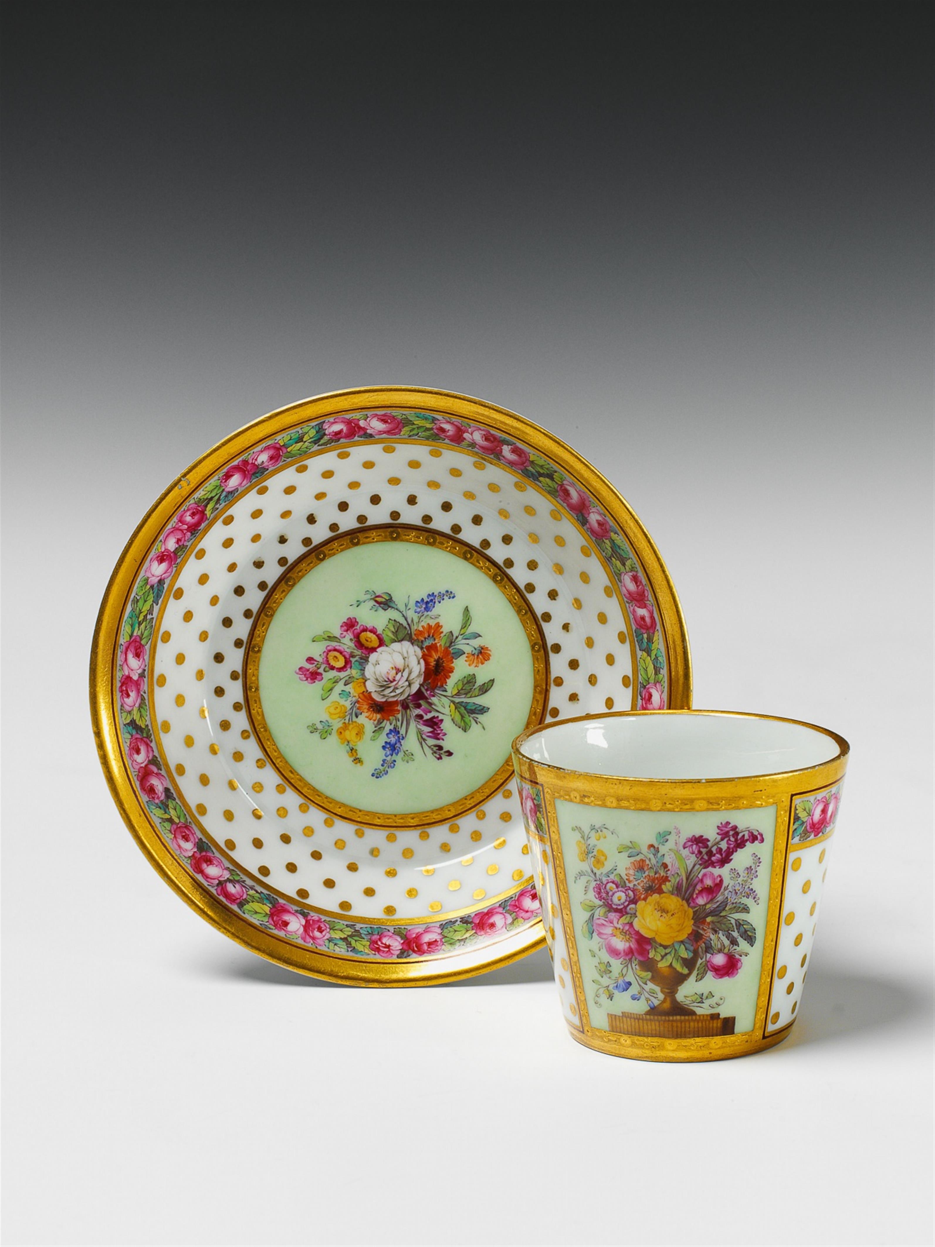 A Berlin KPM porcelain cup and saucer with a floral still life. - image-1
