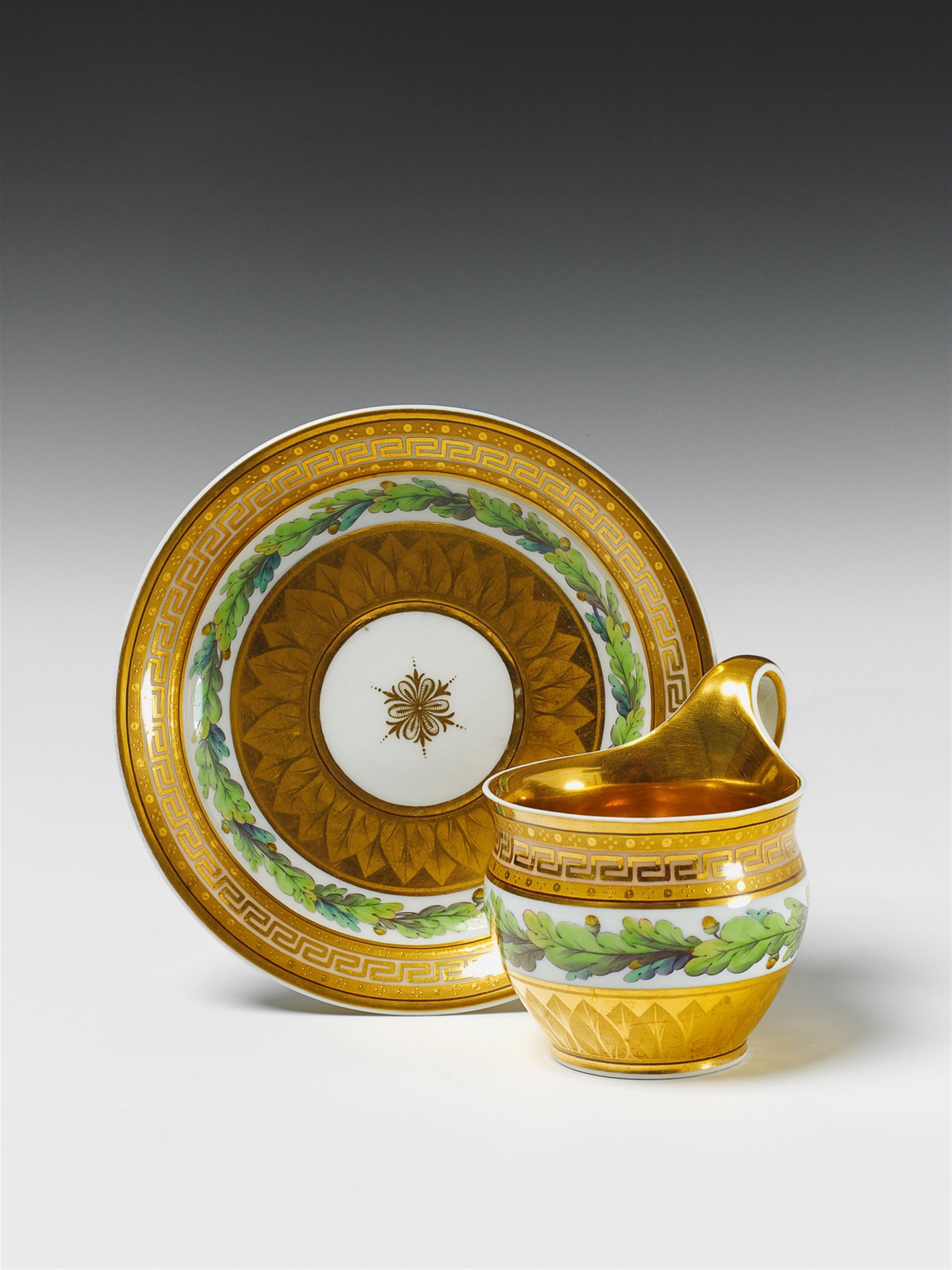 A Berlin KPM porcelain cup with oak leaf decor. - image-1