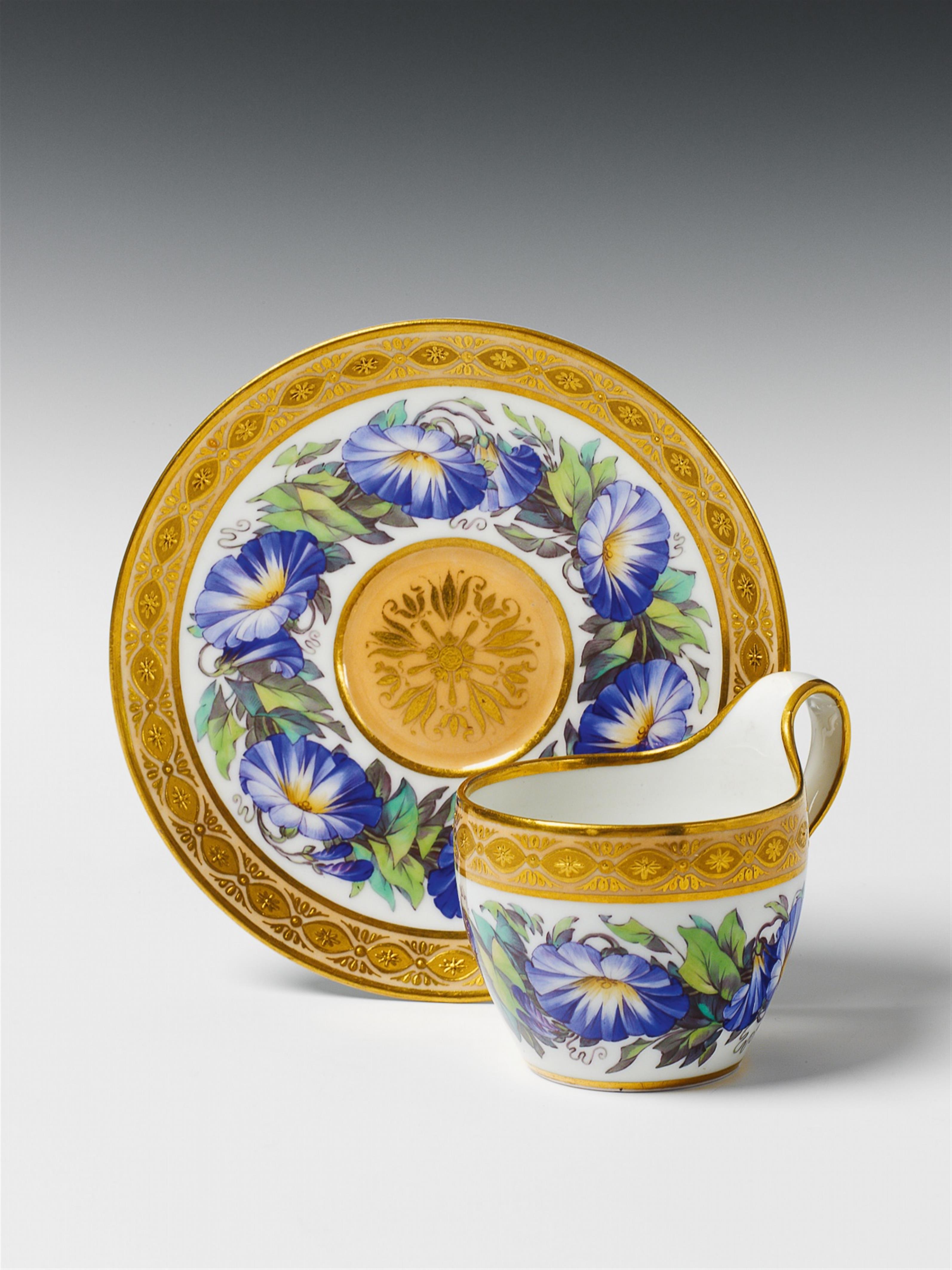 A Berlin KPM porcelain cup and saucer with morning glory flower decor. - image-1