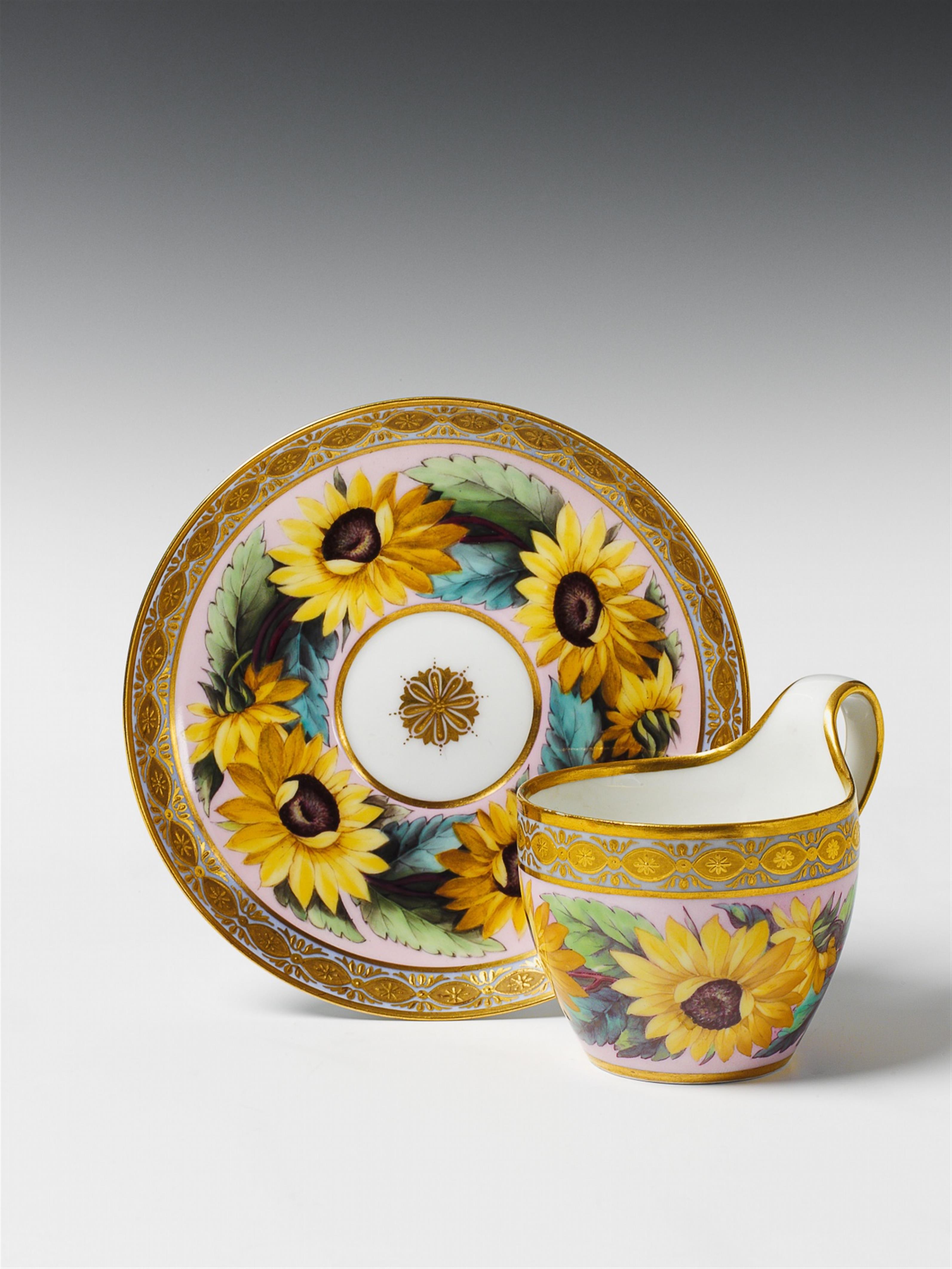 A Berlin KPM porcelain cup and saucer with sunflowers on a pink ground. - image-1
