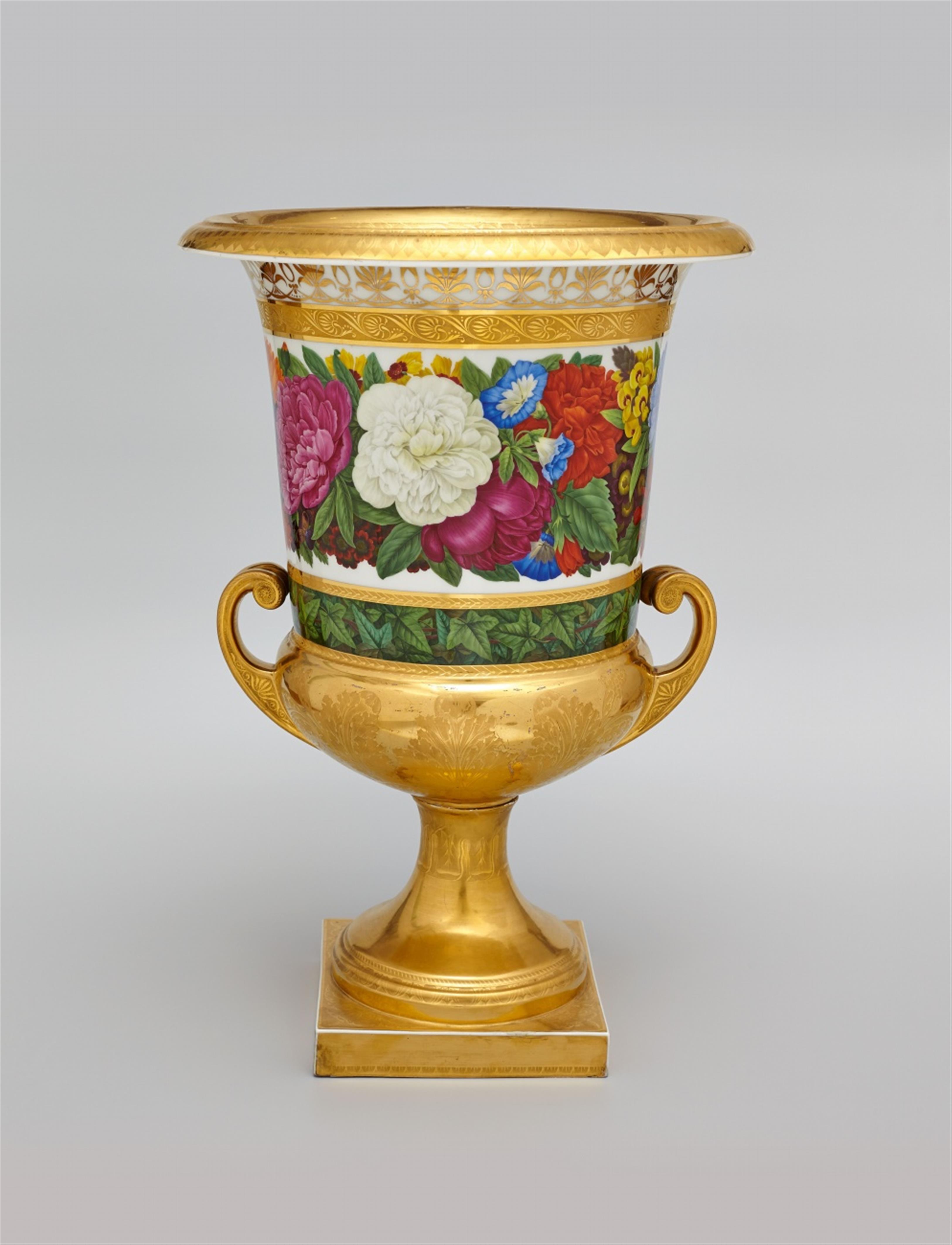 A pair of Berlin KPM porcelain krater form vases with floral and foliate décor. - image-1