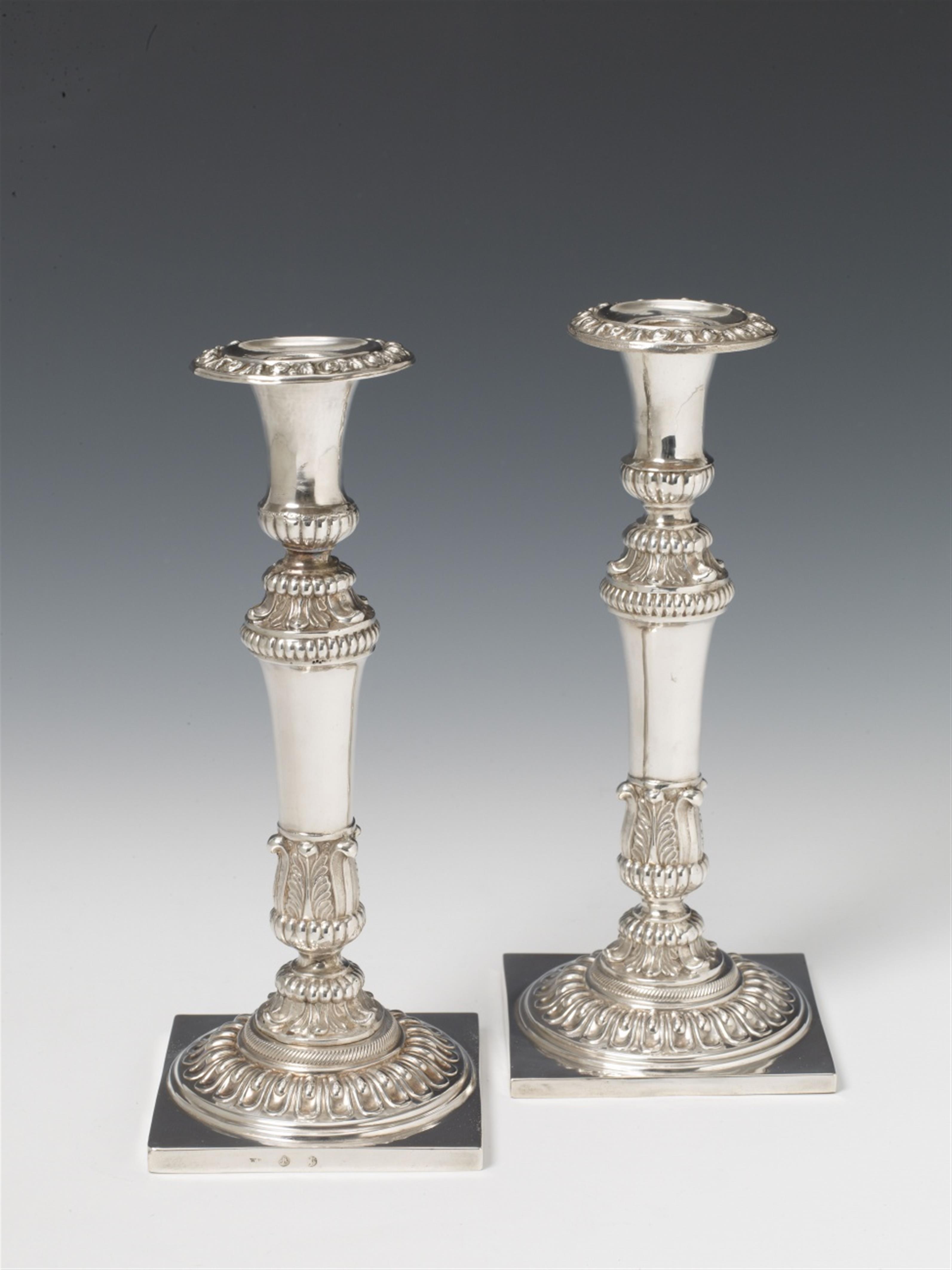 A pair of Berlin silver neoclassical candlesticks. One with marks of Johann George Wilhelm Peters, ca. 1840; one unmarked. - image-1