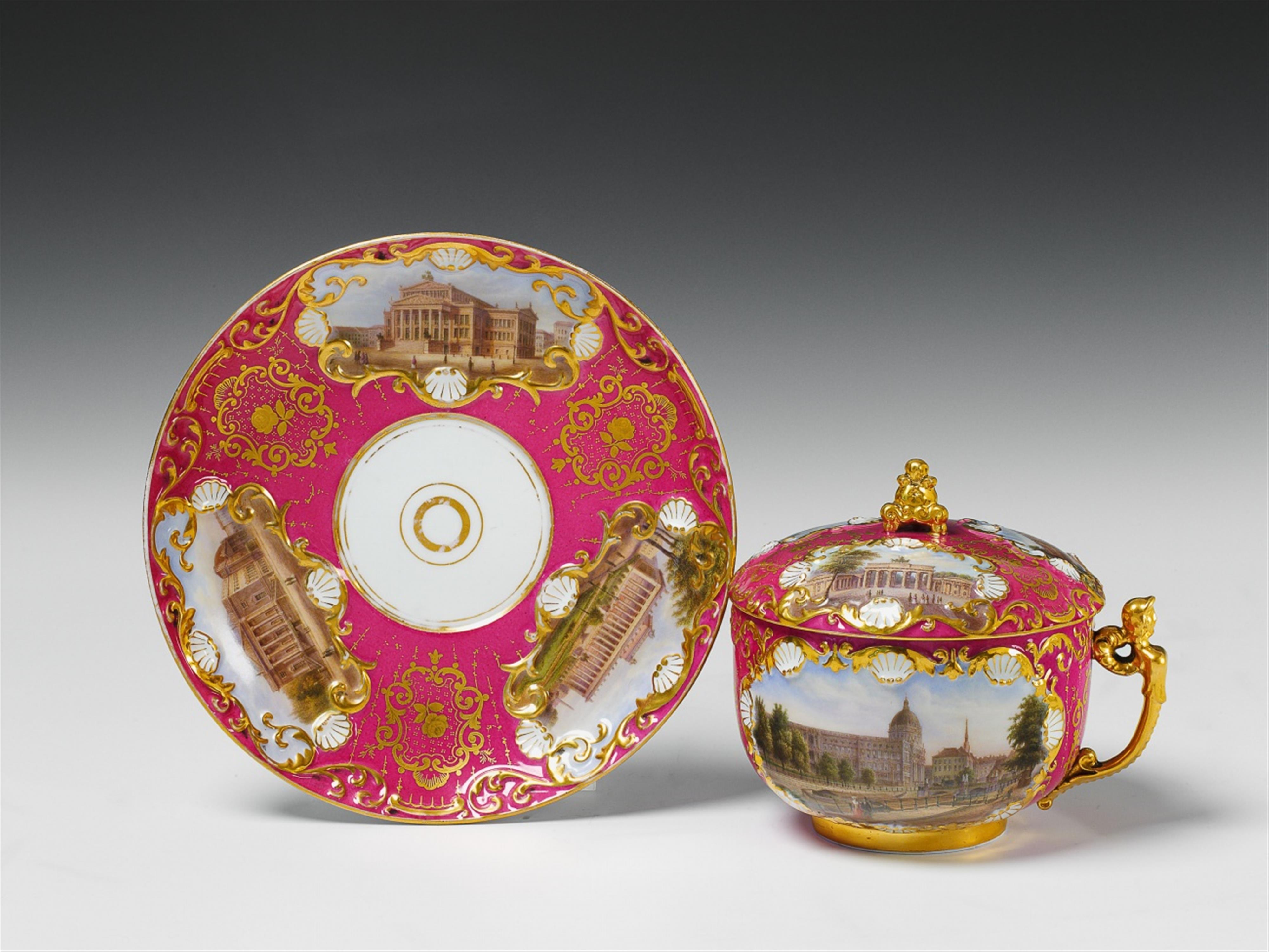 A Berlin KPM porcelain covered cup and saucer with views of Berlin. - image-1