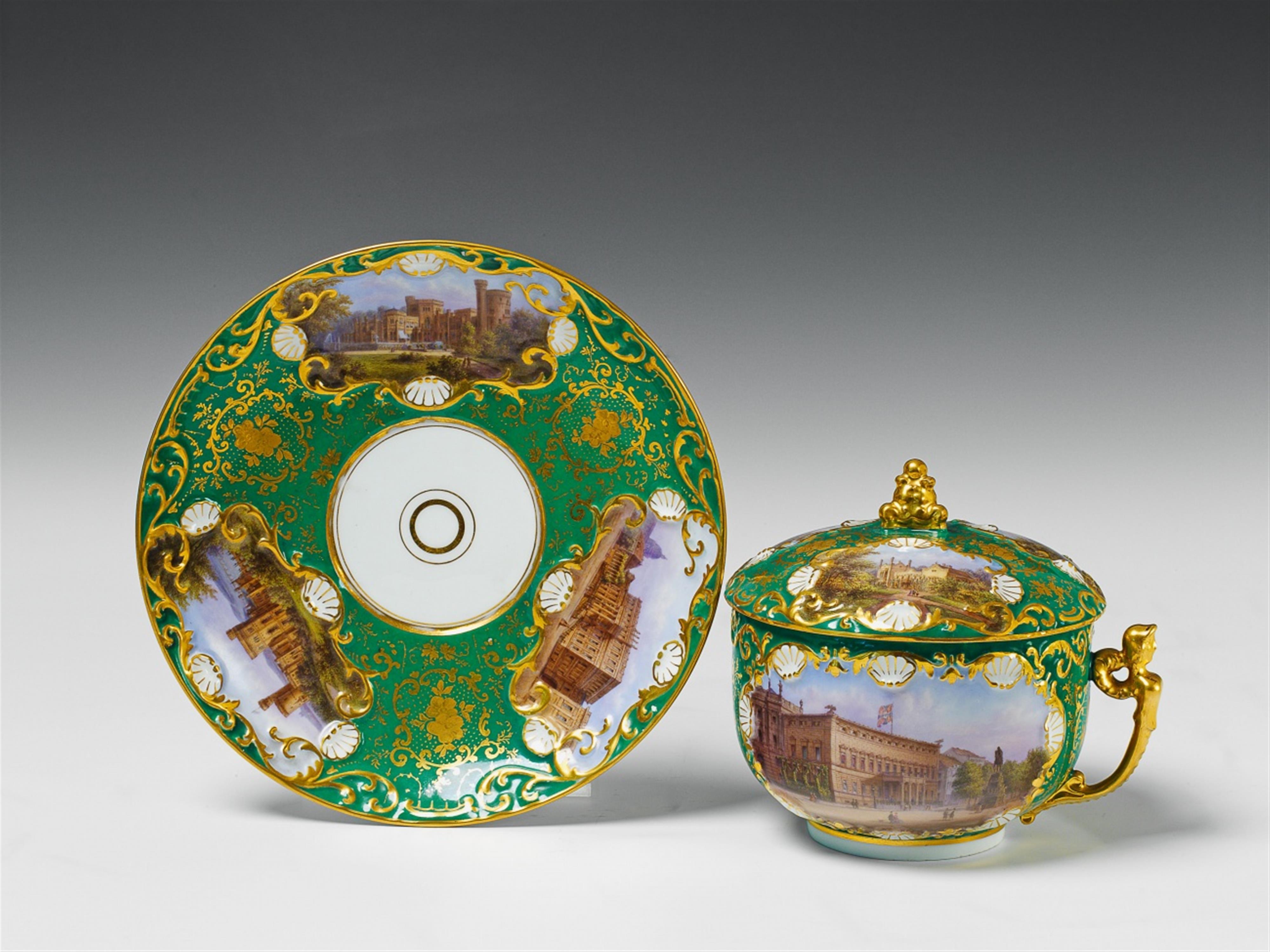 A Berlin KPM porcelain covered cup and saucer with views of Berlin. - image-1