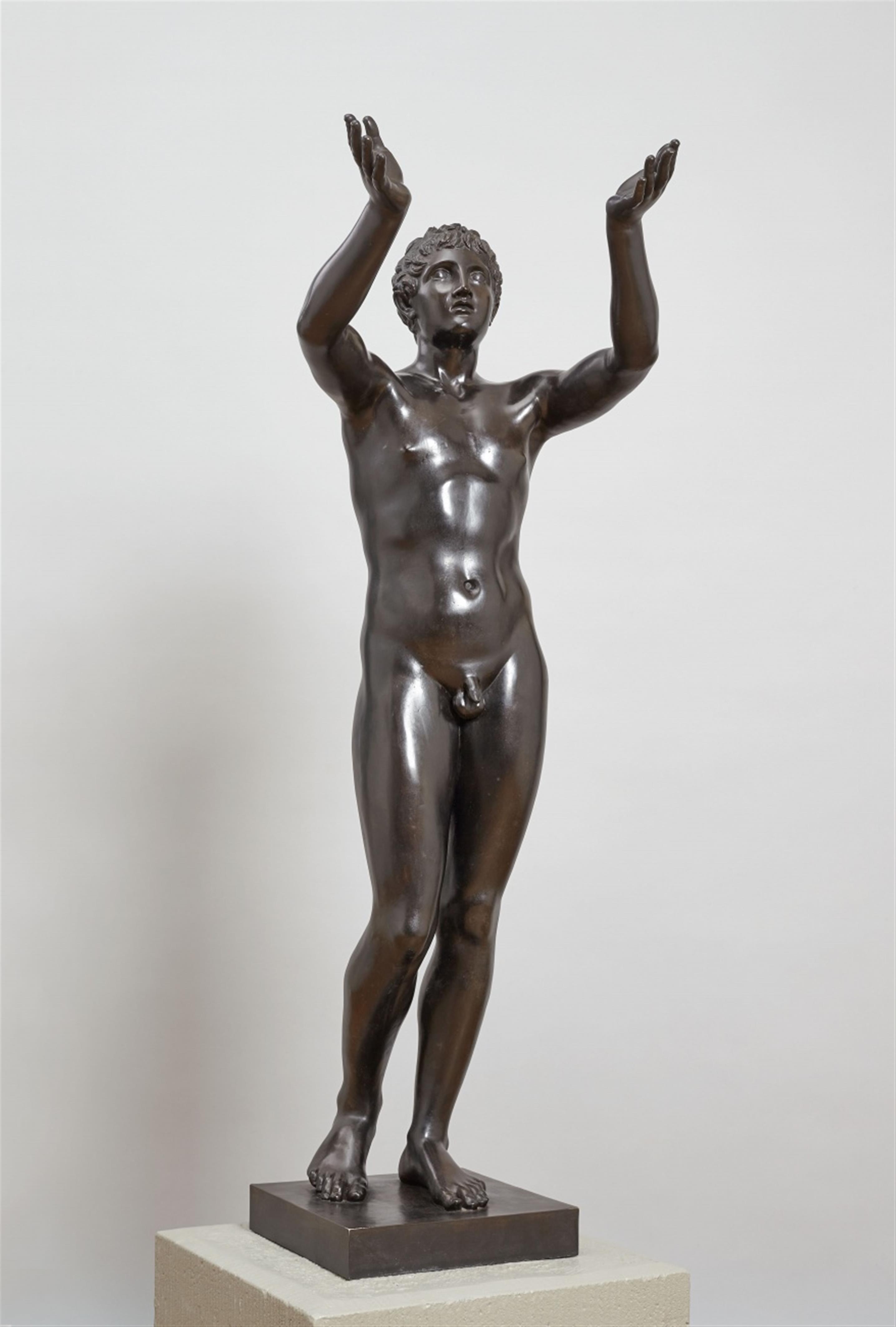 A black patinated galvinated metal figure of the praying boy. - image-1
