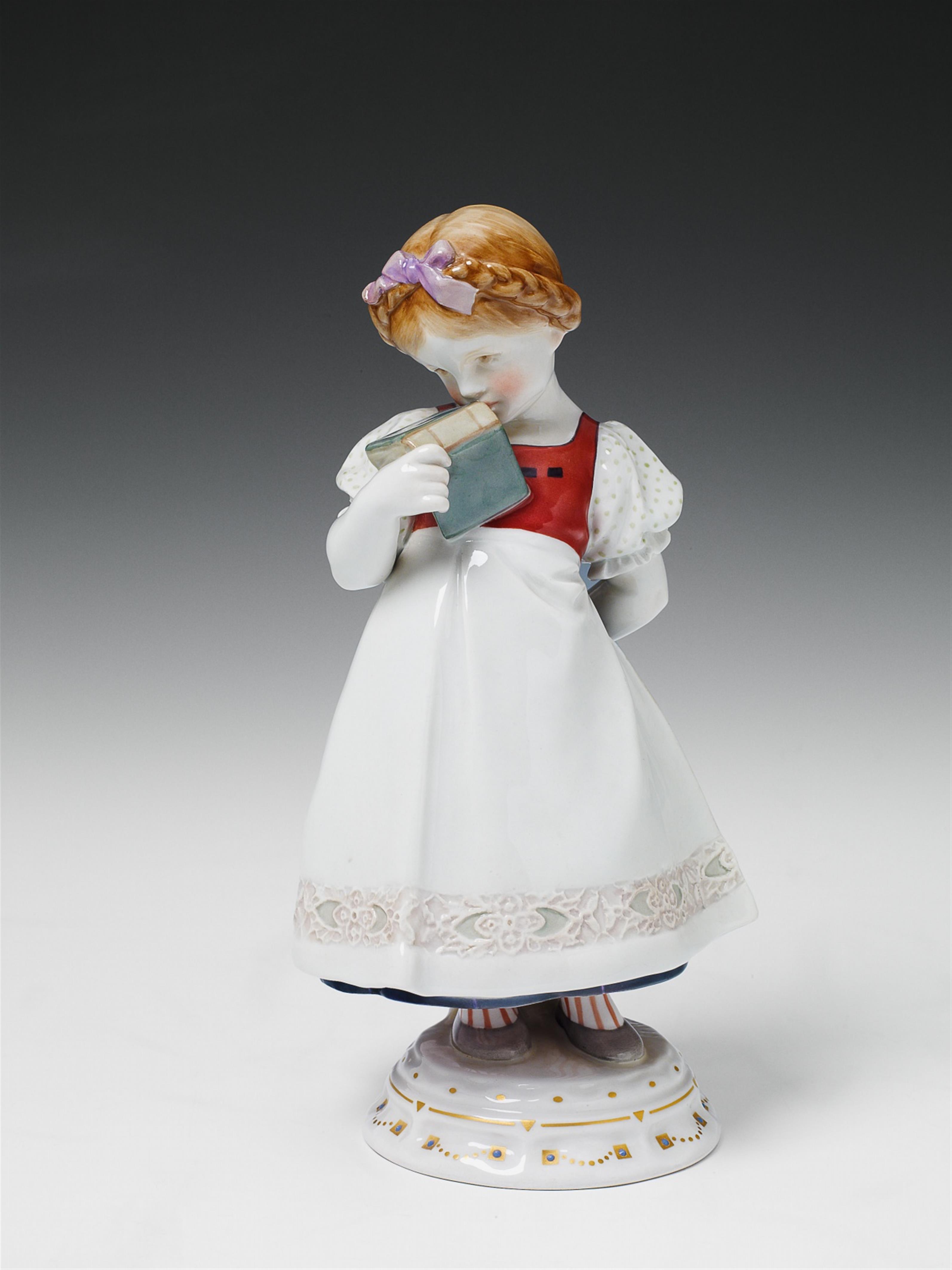 A Berlin KPM porcelain figure of a schoolgirl with a book. - image-1