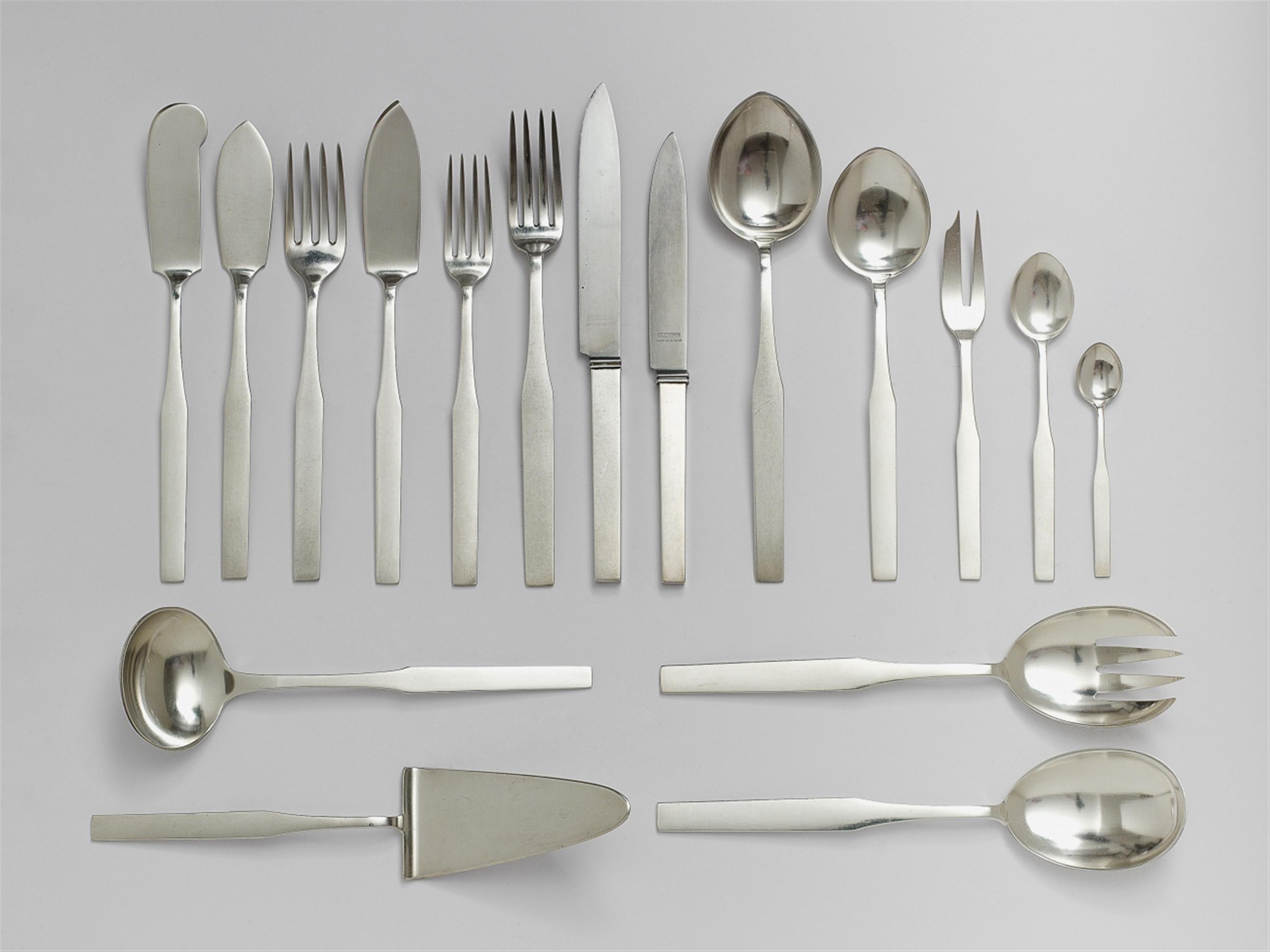 A 67 piece Heilbronn silver cutlery set designed by Emil Lettré. Comprising six dinner and starter knives, forks and spoons, four fish spoons and forks, four cake forks, seven coffee and seven mocca spoons and six serving pieces. Marks of Bruckmann & Söhn - image-1