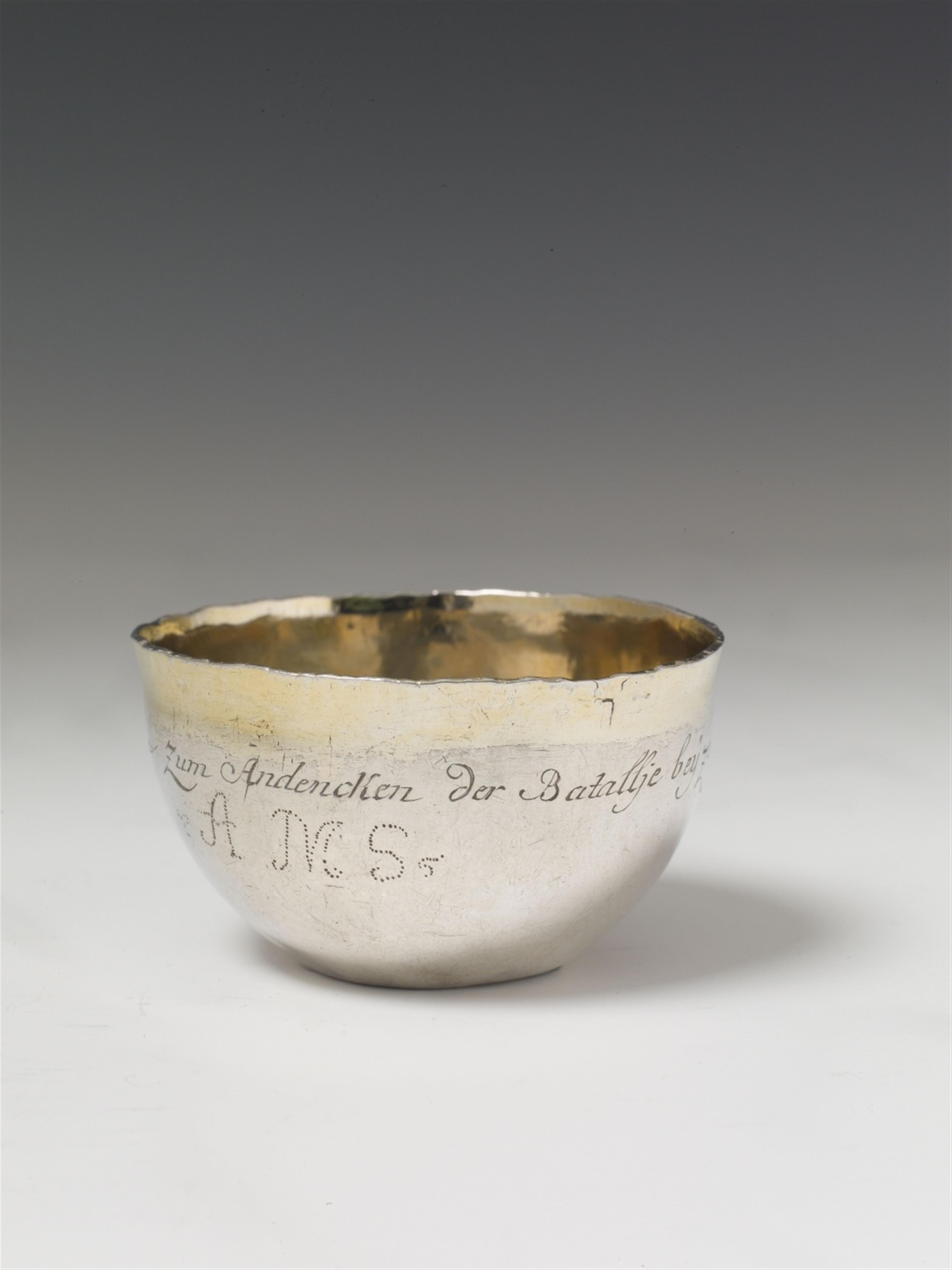 A Prussian silver beaker made from a rubel coin. With remains of gilt. Inscribed "Zum Andenken der Batallje bey Zorndorff" and with a later monogram "AMS". Unmarked, ca. 1760. - image-1
