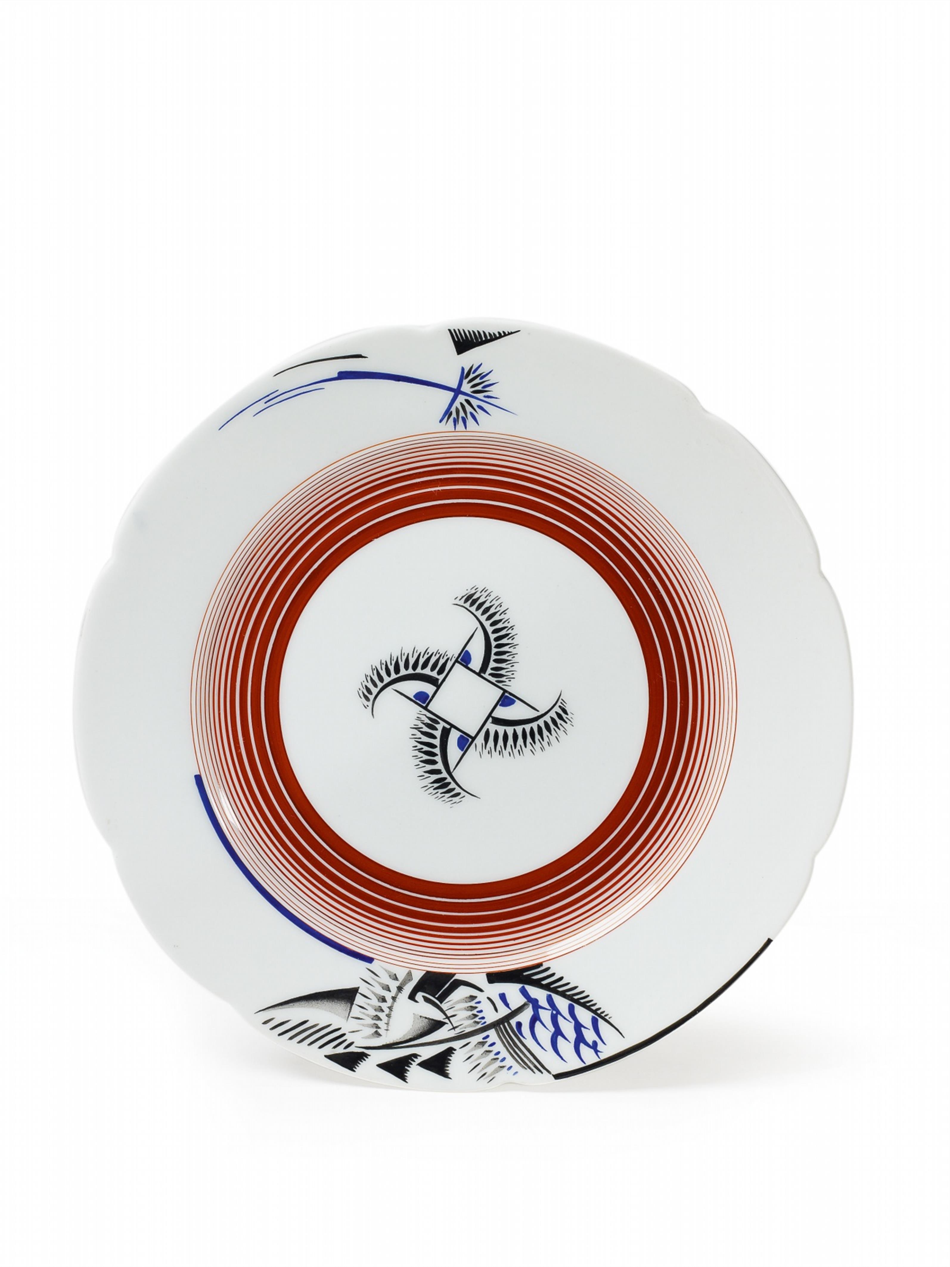 A shaped porcelain plate with stylised enamel decor. - image-1