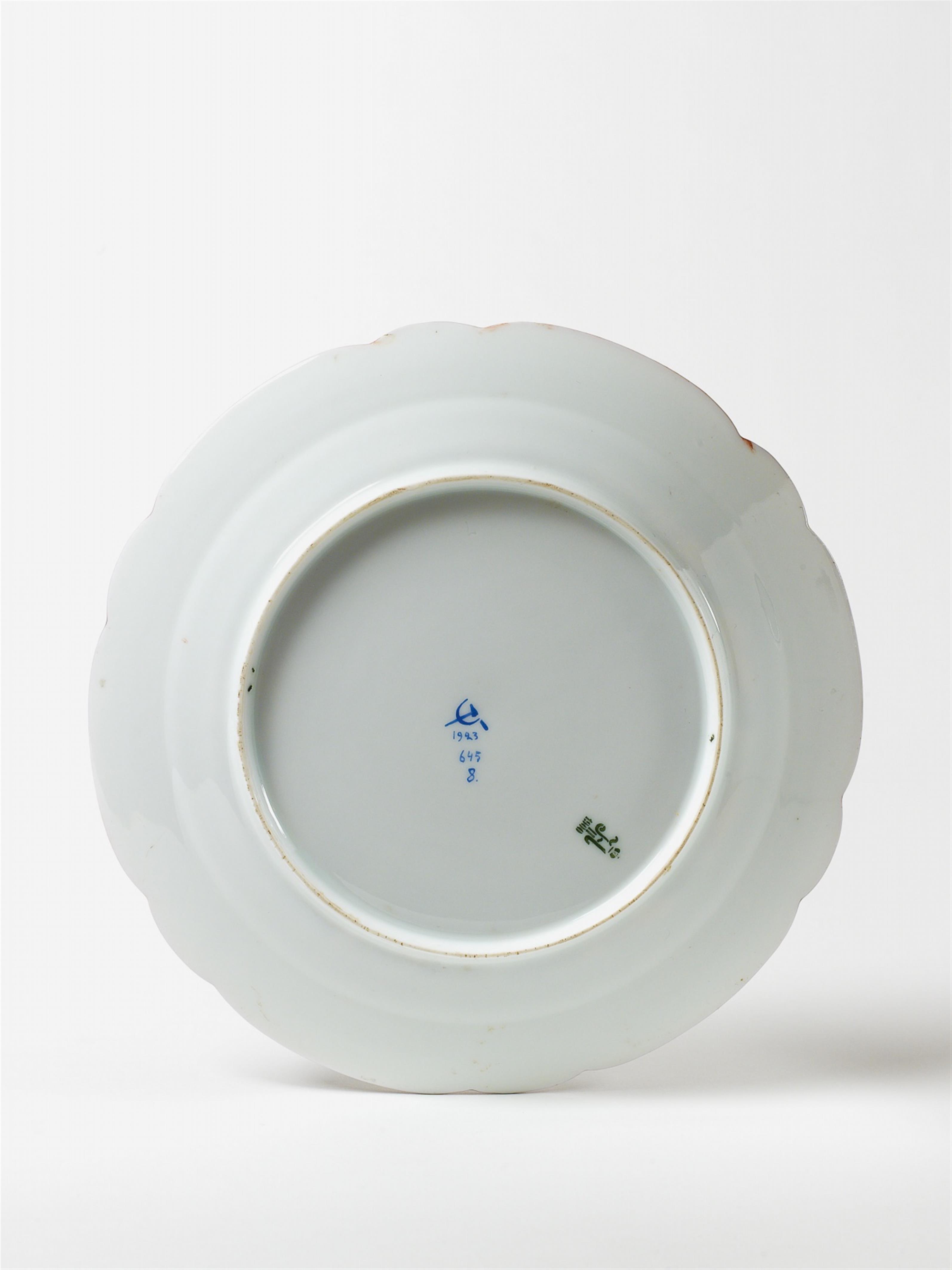 A shaped porcelain plate enamel decorated with a stylised Russian fairytale motif. - image-3