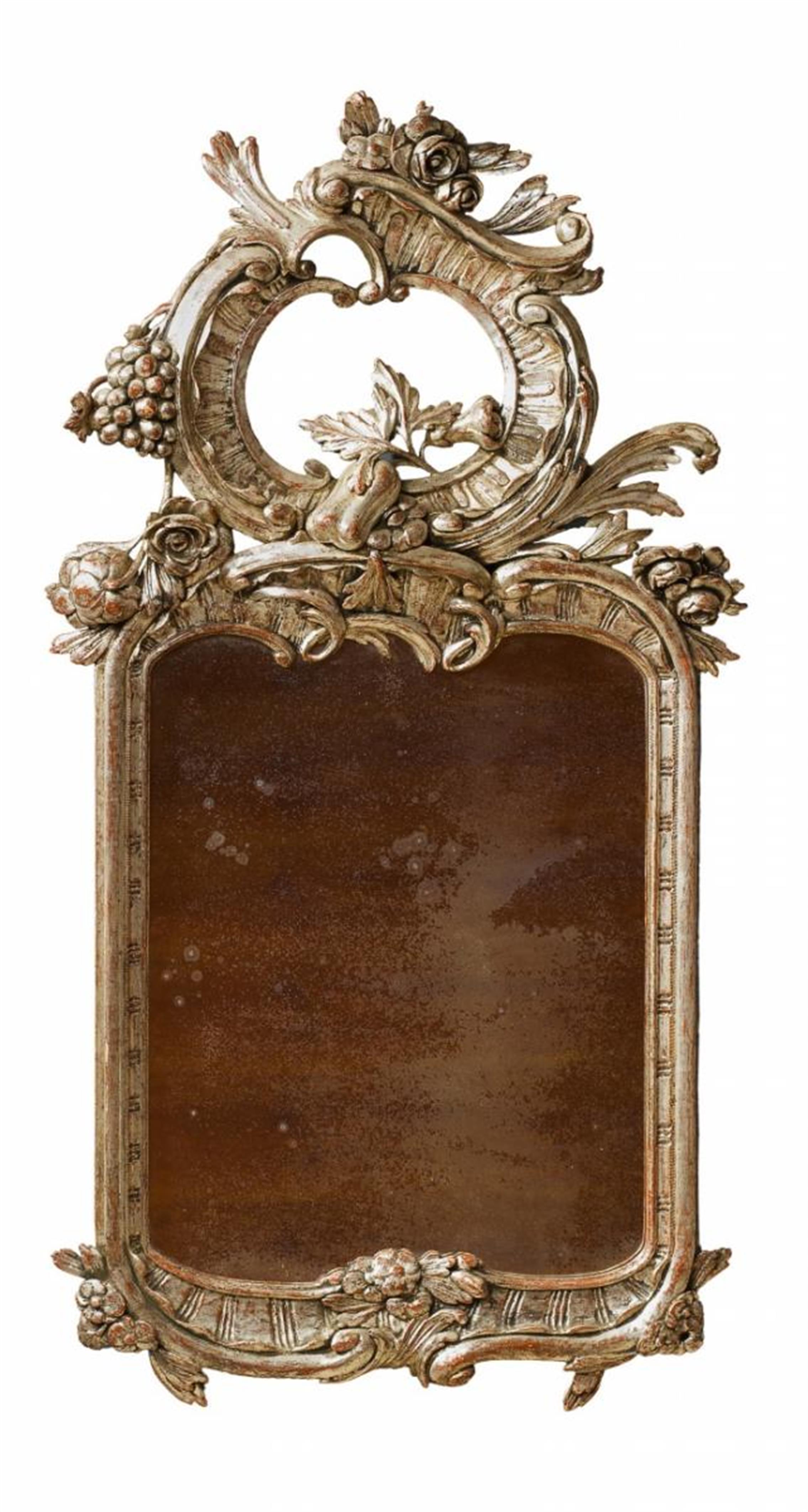 A carved, silver-gilt softwood Frederician Rococo mirror. - image-1