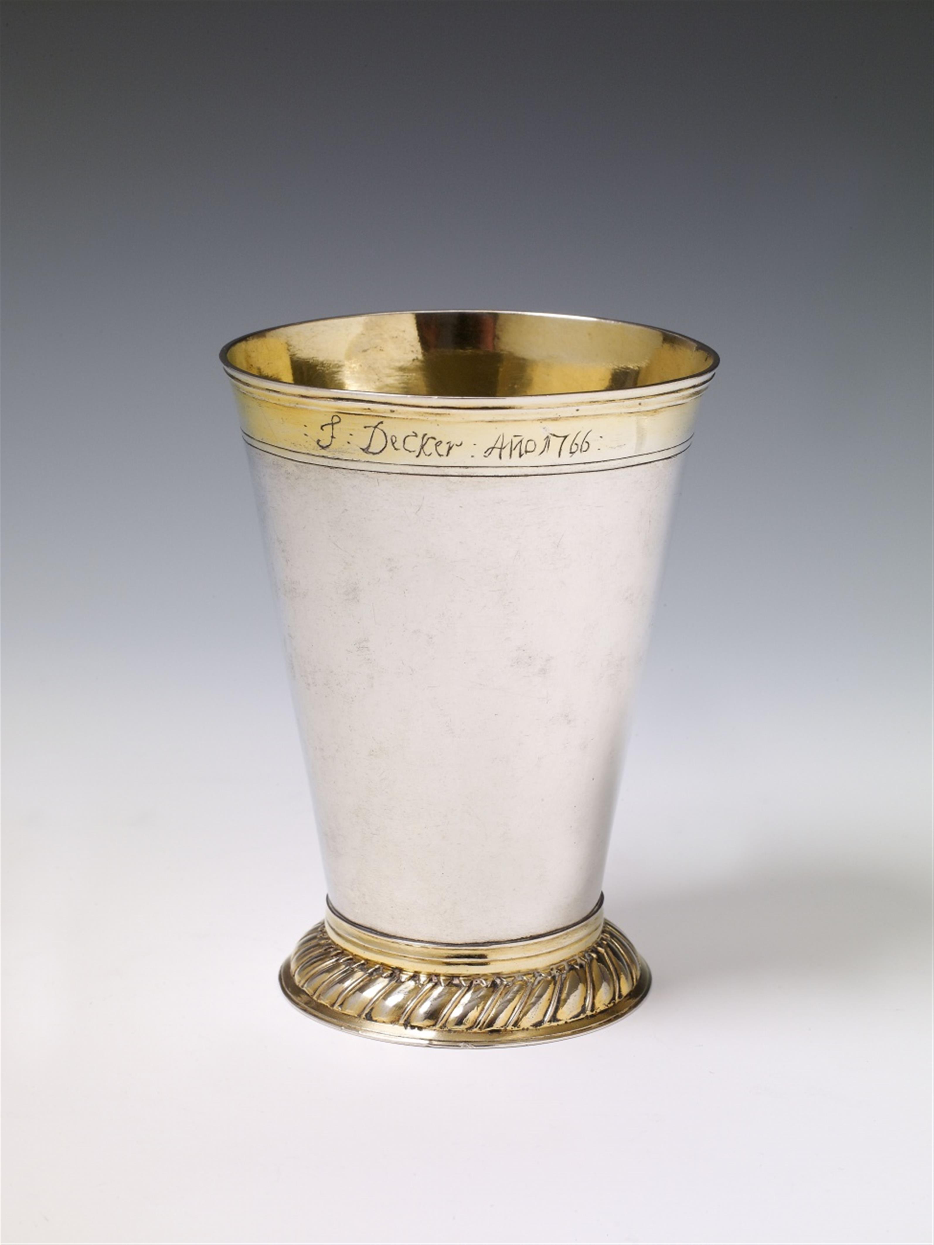 A silver partially gilt beaker. Set to the underside with a silver medallion made by Sebastian Dadler (1632) commemorating the death of Gustav II Adolf of Sweden and with owner's engravings "J:Decker:Ano 1766:" and "J.K. 13 XII 1887" beneath the rim. Unma - image-1