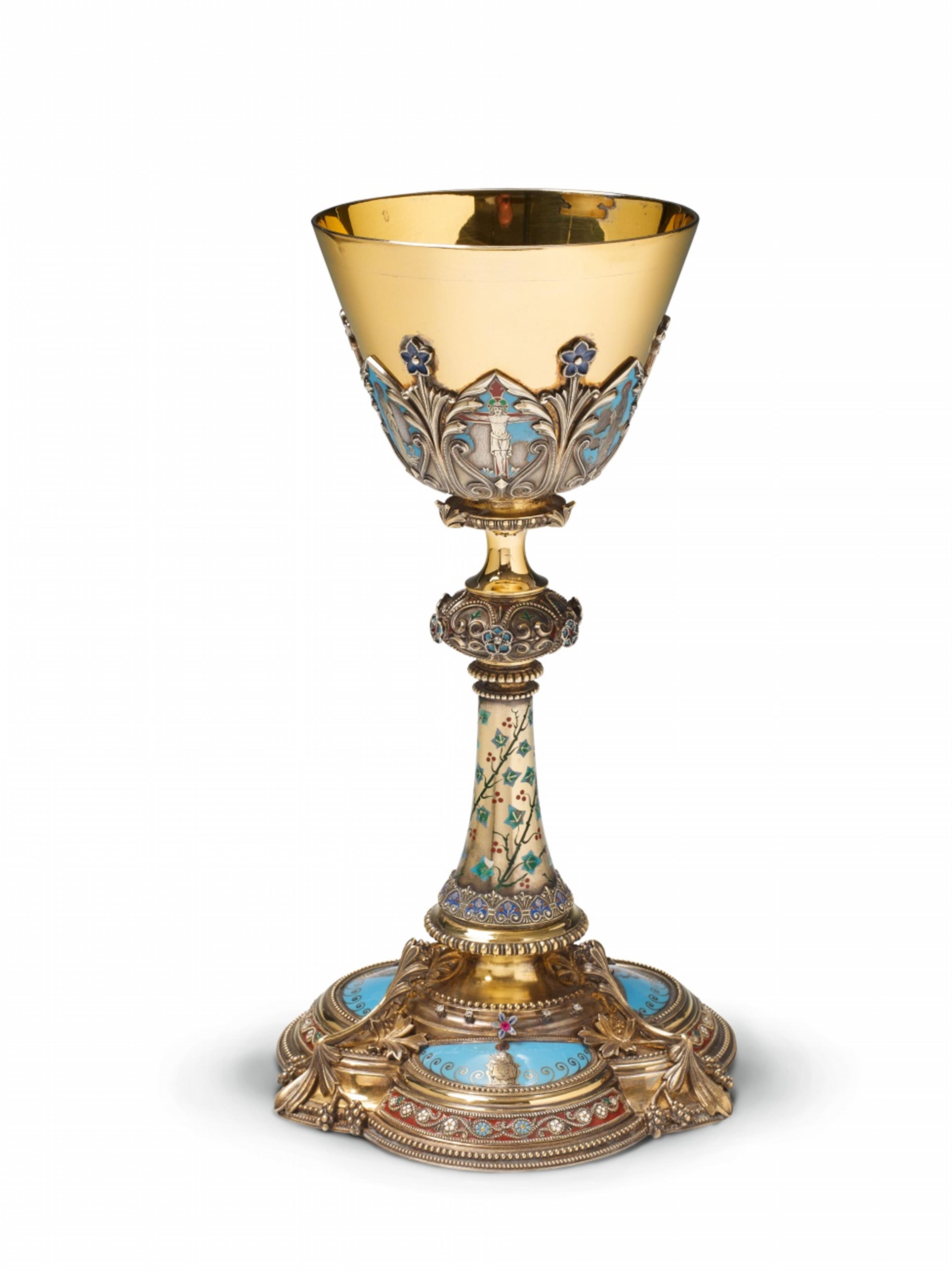 A Lyon silver gilt historicist communion chalice. Set with diamonds and coloured stones and with slightly worn enamelled biblical decor. With an engraved dedication "+ L. L. PÂQUES 1877." to the underside. Marks of Thomas Joseph Armand-Calliat, ca. 1870. - image-1
