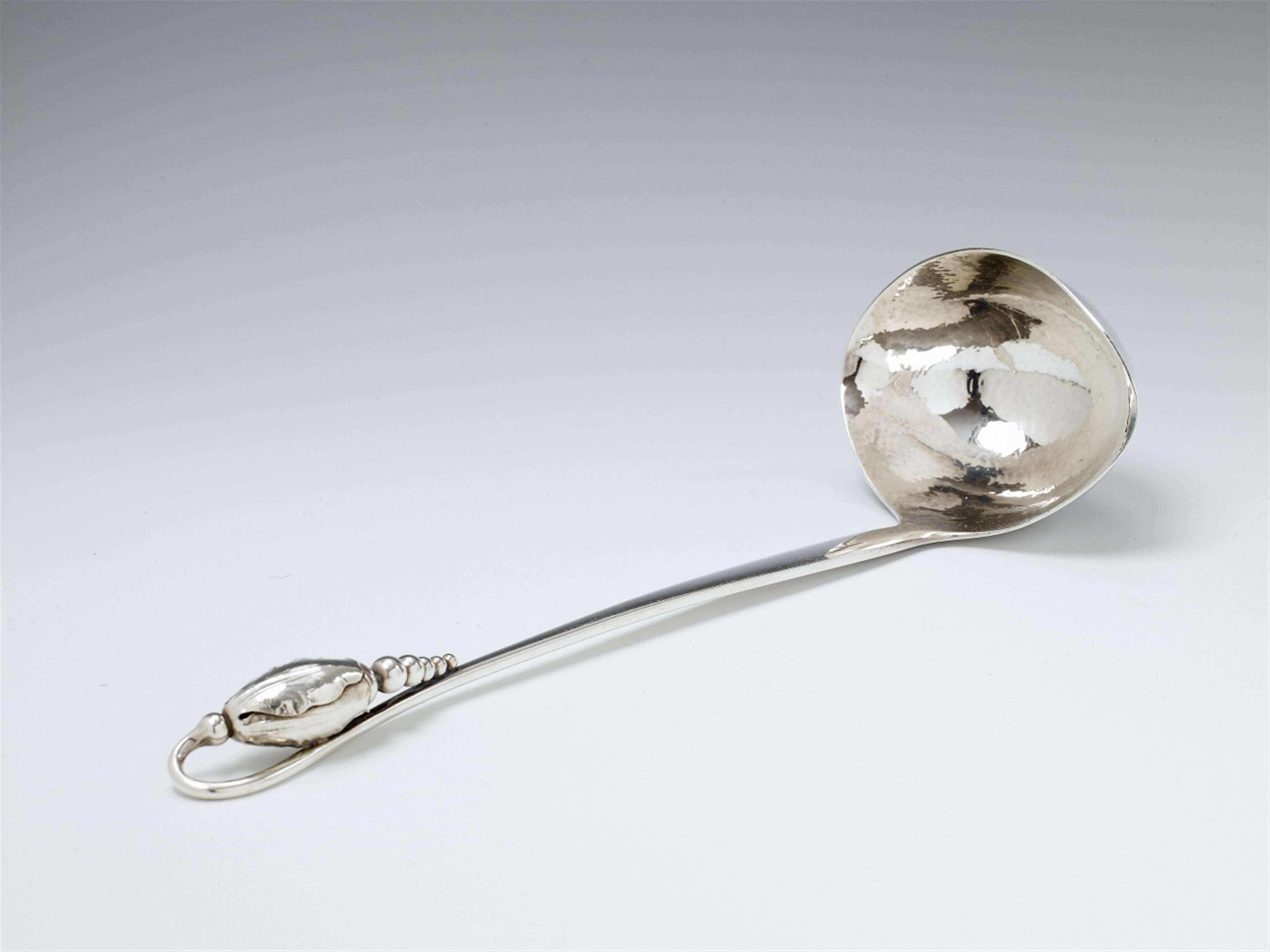 A large Copenhagen silver soup ladle, no. 84. Blossom pattern. Marks of Georg Jensen, designed in 1919; made 1945 - 76. - image-1