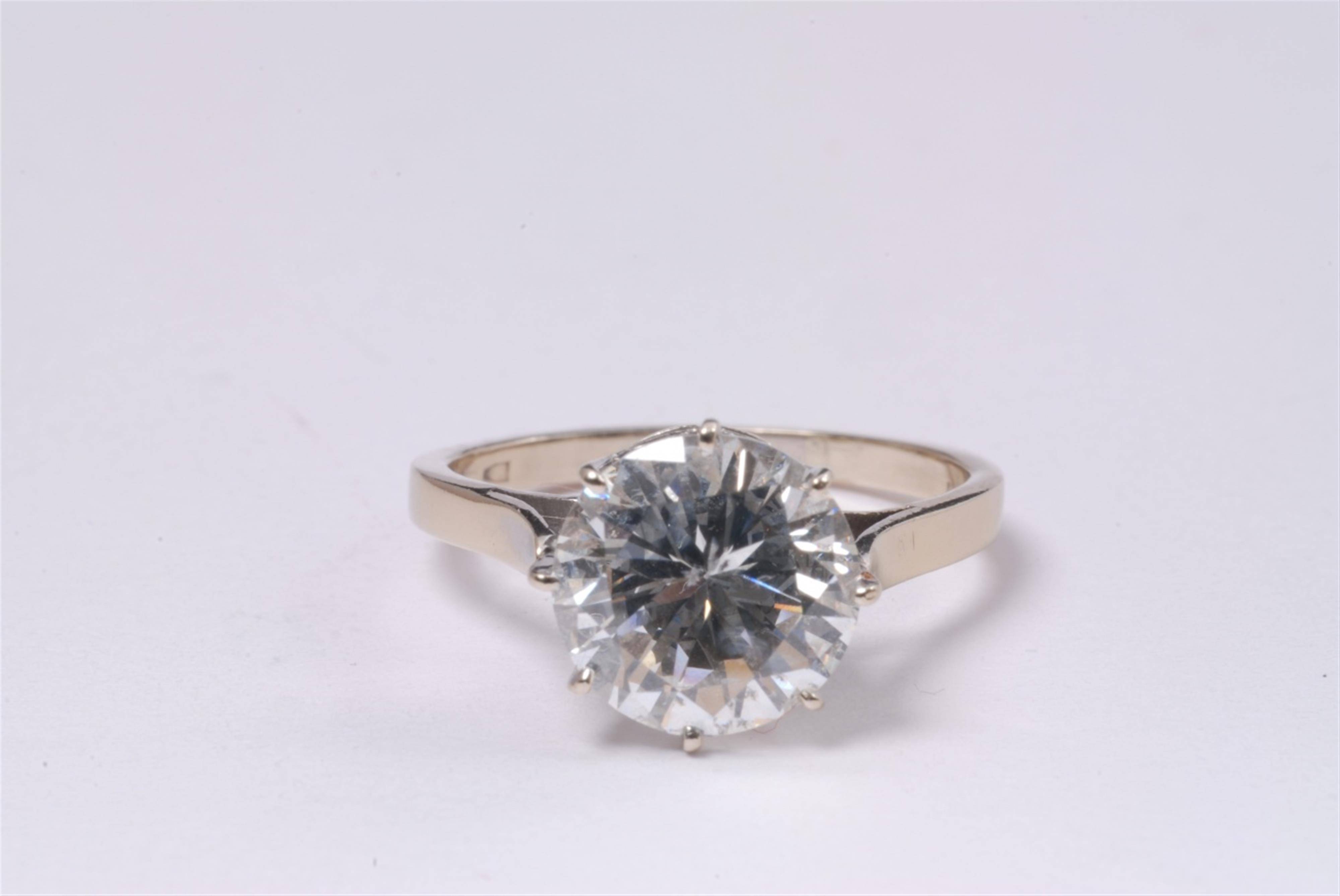 A 14k white gold diamond solitaire ring. - image-1
