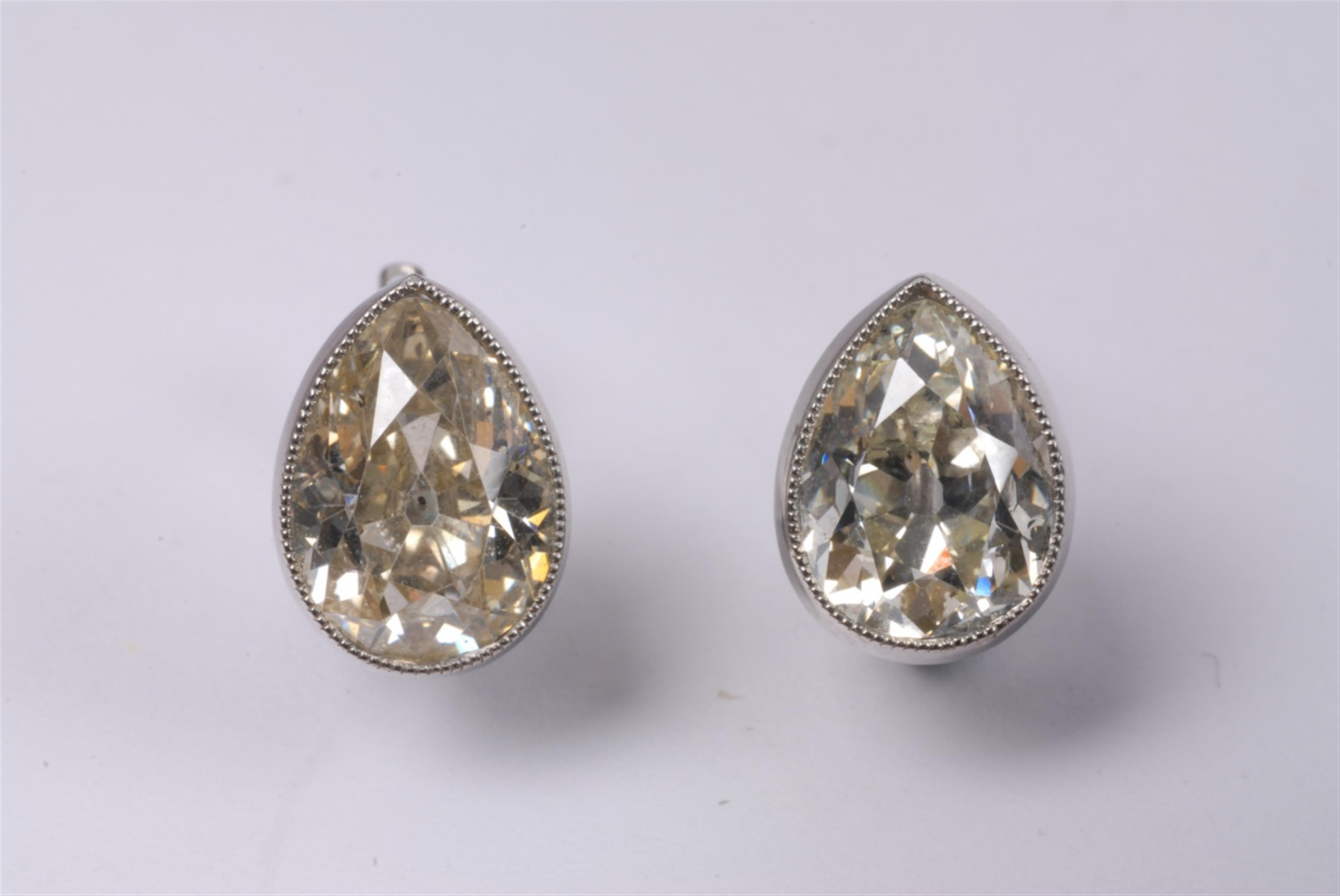 A pair of 14k white gold and diamond art déco earrings. - image-3