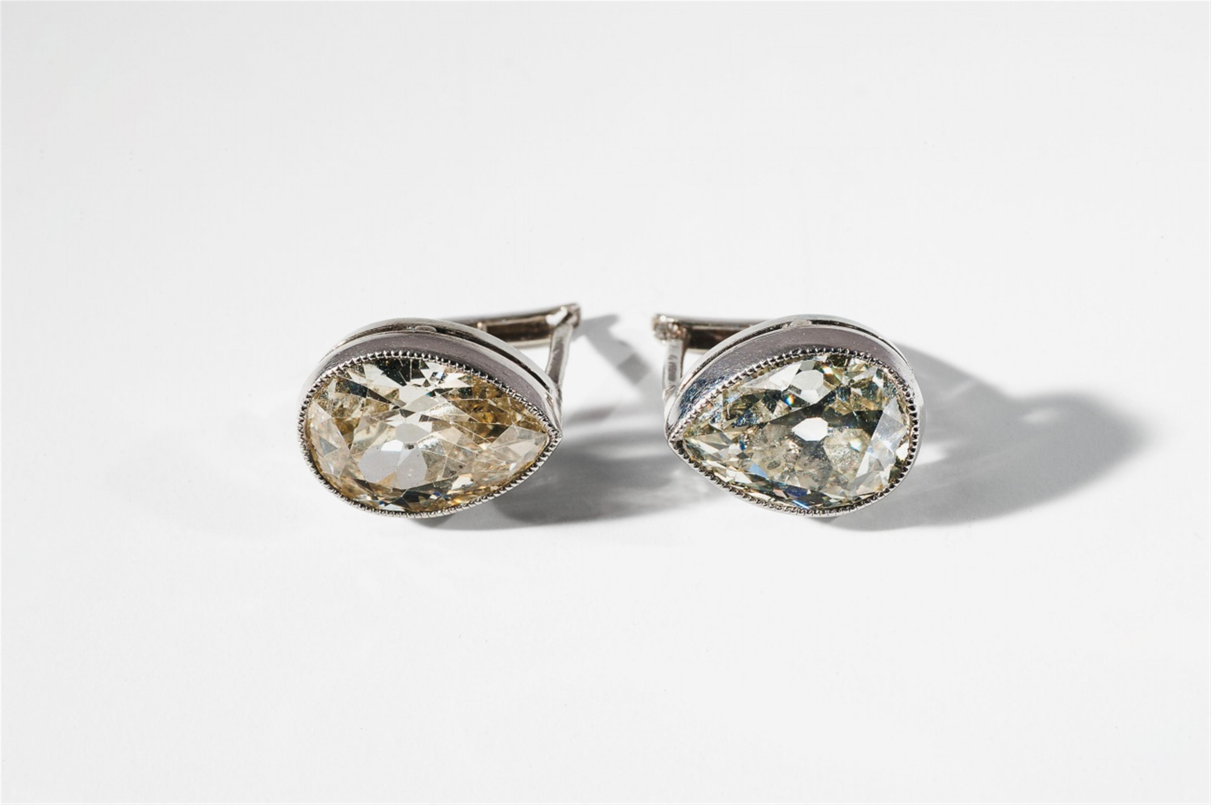A pair of 14k white gold and diamond art déco earrings. - image-1