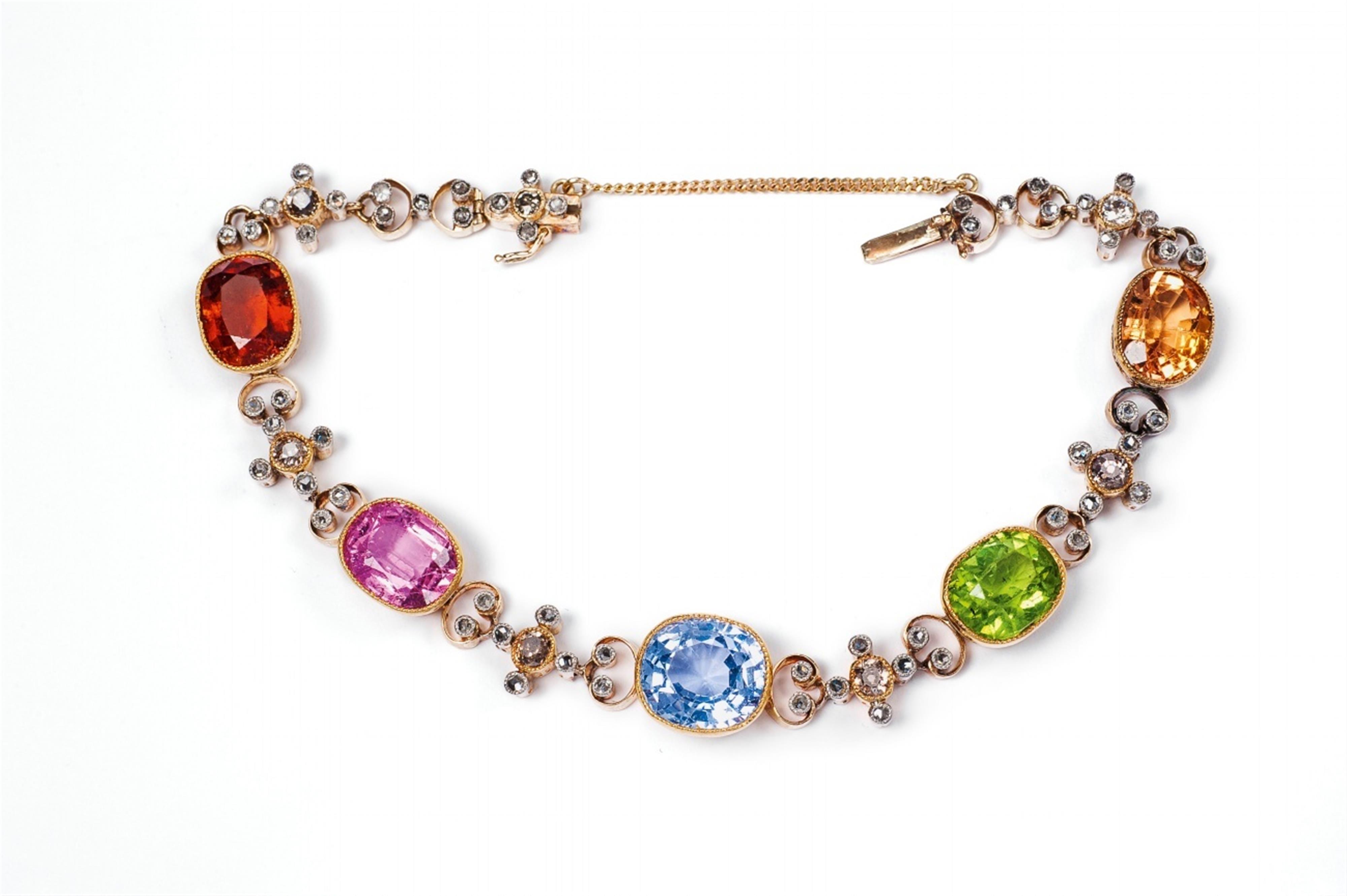 A 14k gold belle epoque bracelet with coloured stones. - image-1