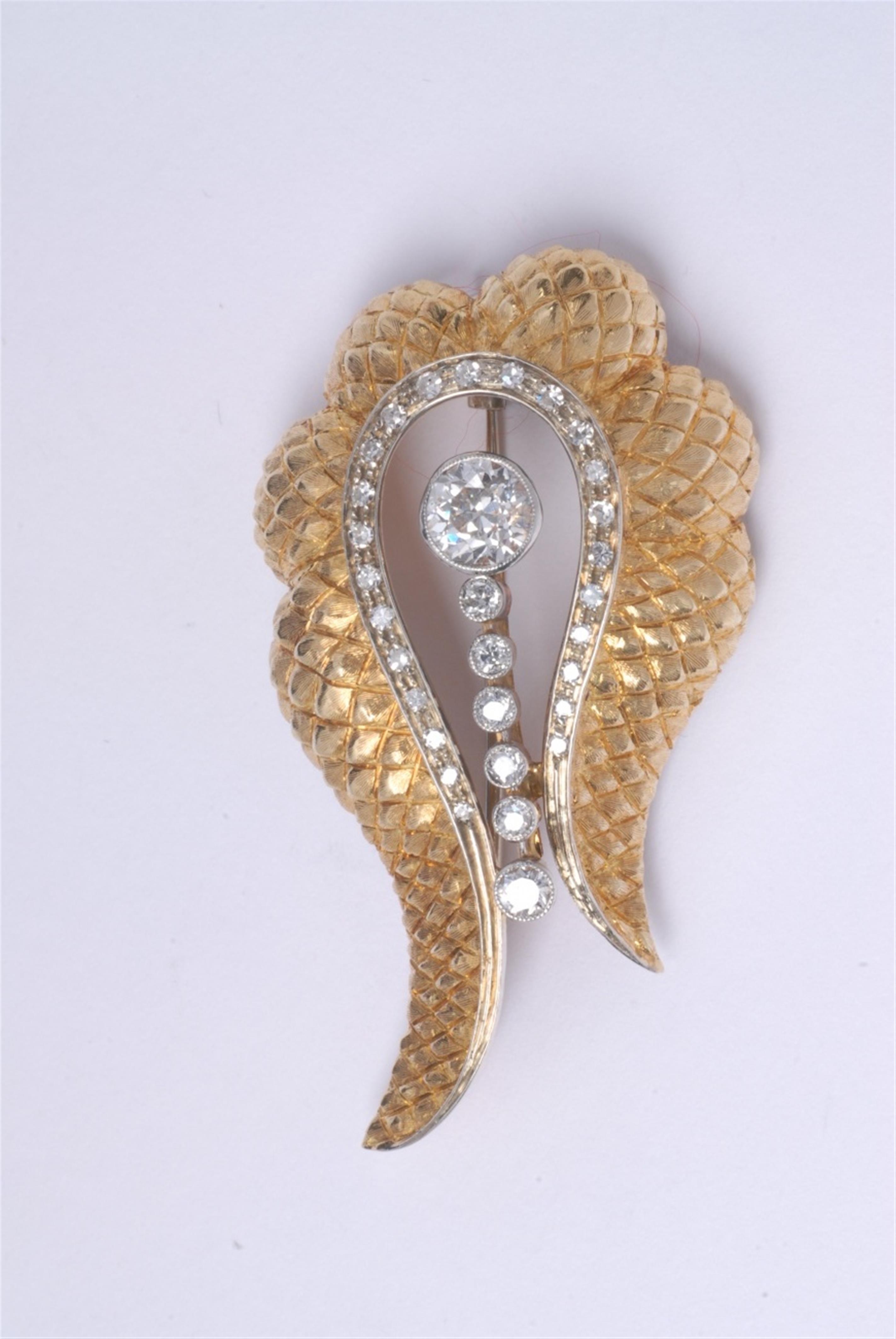 An 18k gold and diamond brooch. - image-1