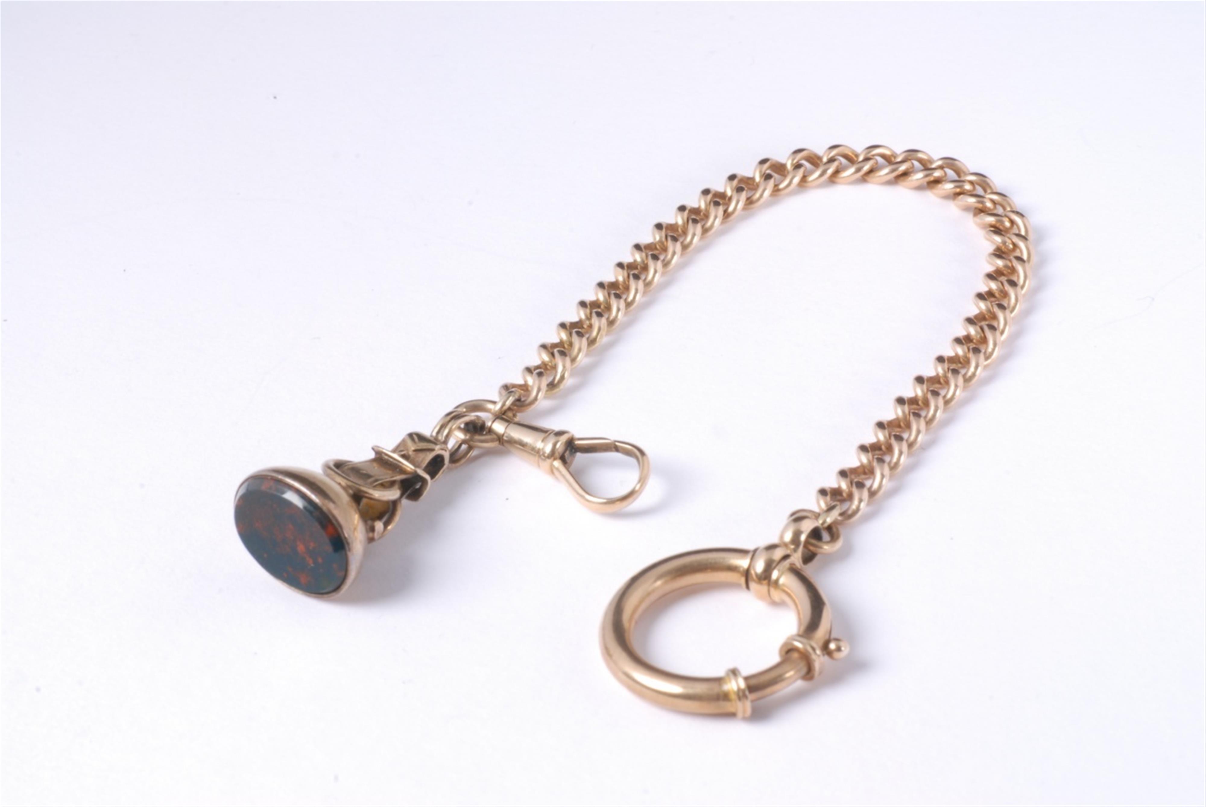A 14k red gold watch chain with a signet pendant. - image-1