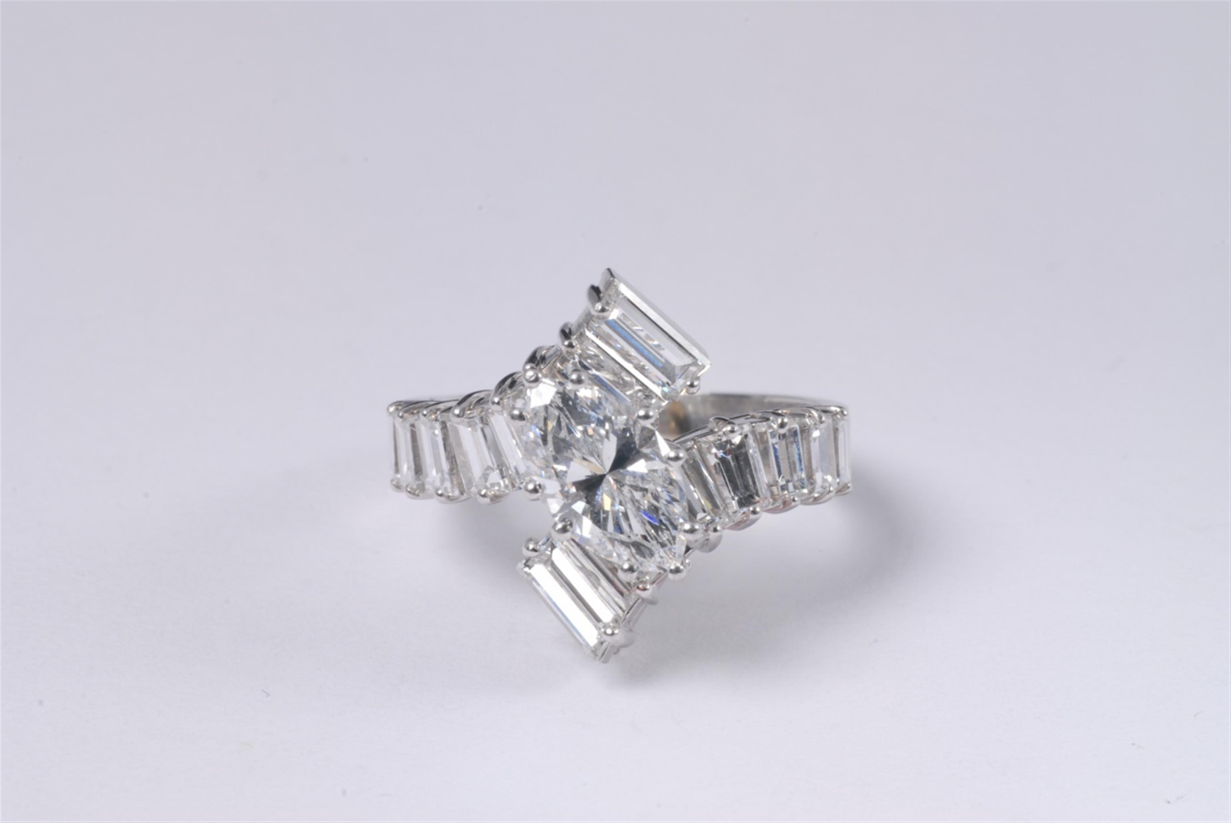 A platinum and diamond crossover ring - image-1