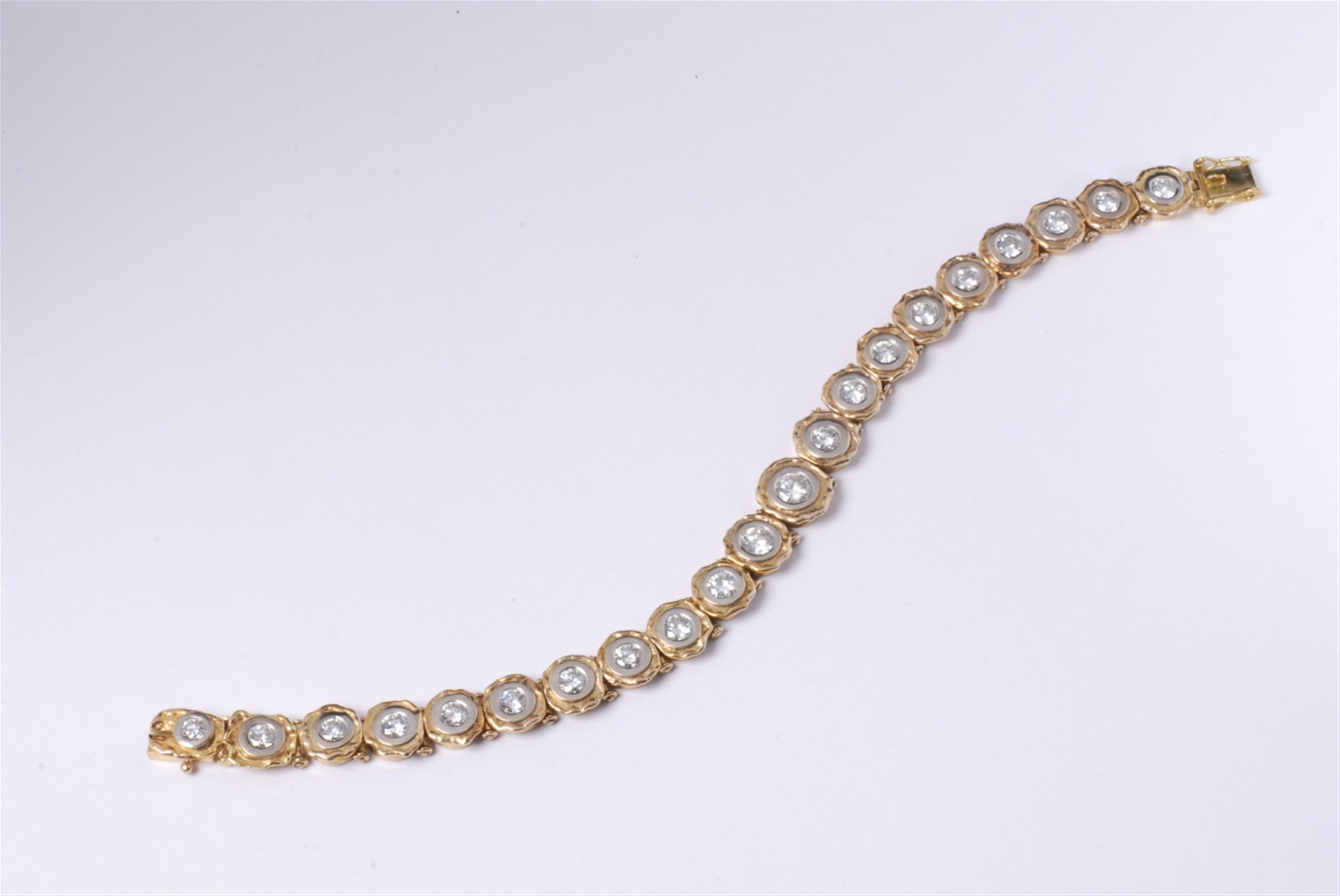 An 18k yellow gold and 14k white gold riviere bracelet - image-1