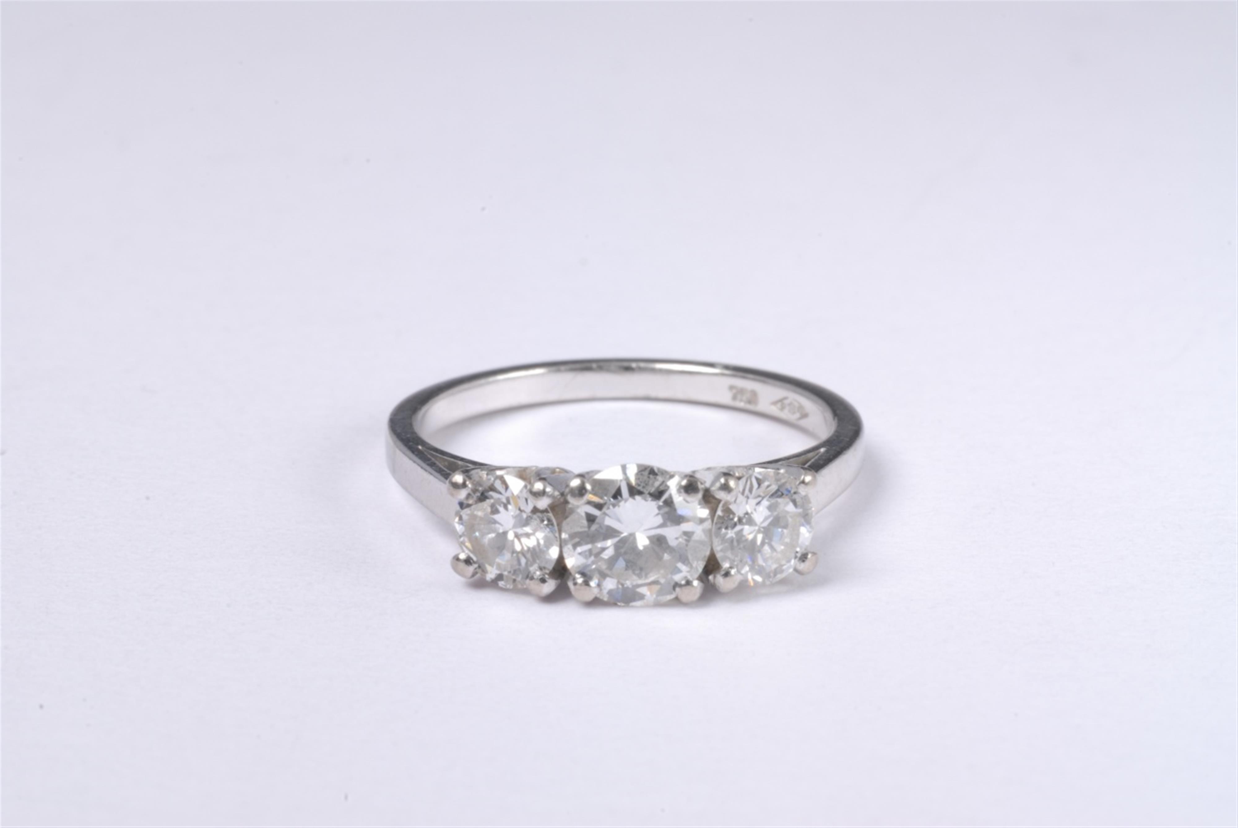 An 18k white gold three stone ring - image-1