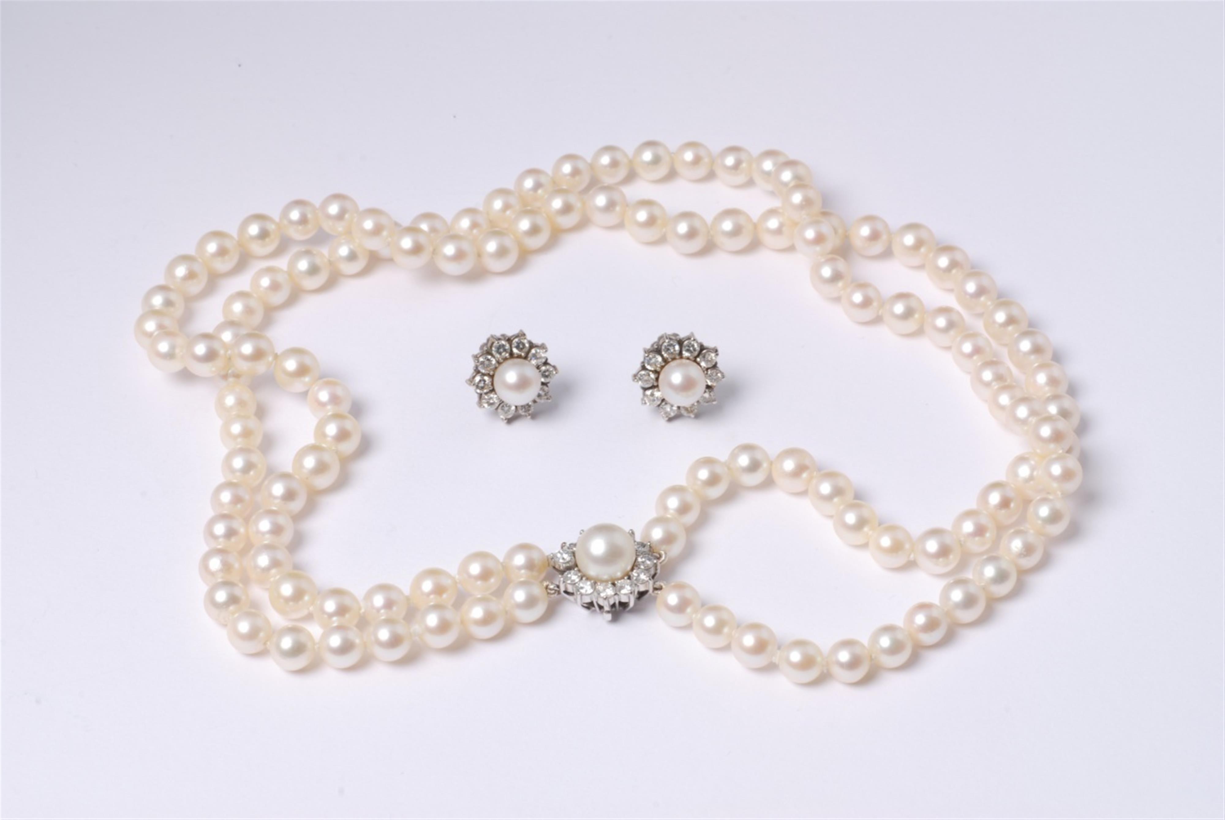 An 18k white gold and pearl two stranded demi-parure - image-1