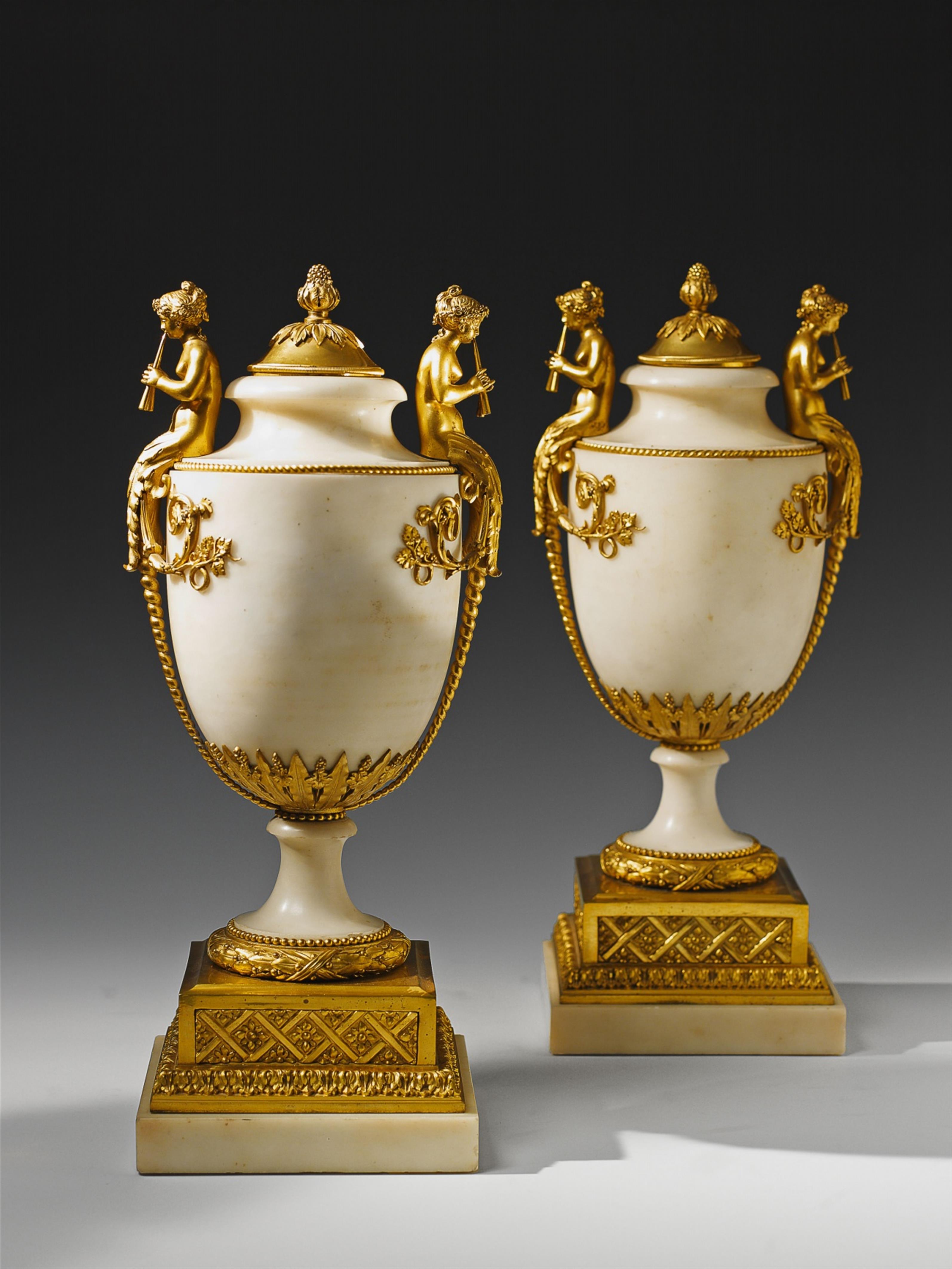A pair of French époque Louis XVI ormolu mounted white marble vases. - image-1