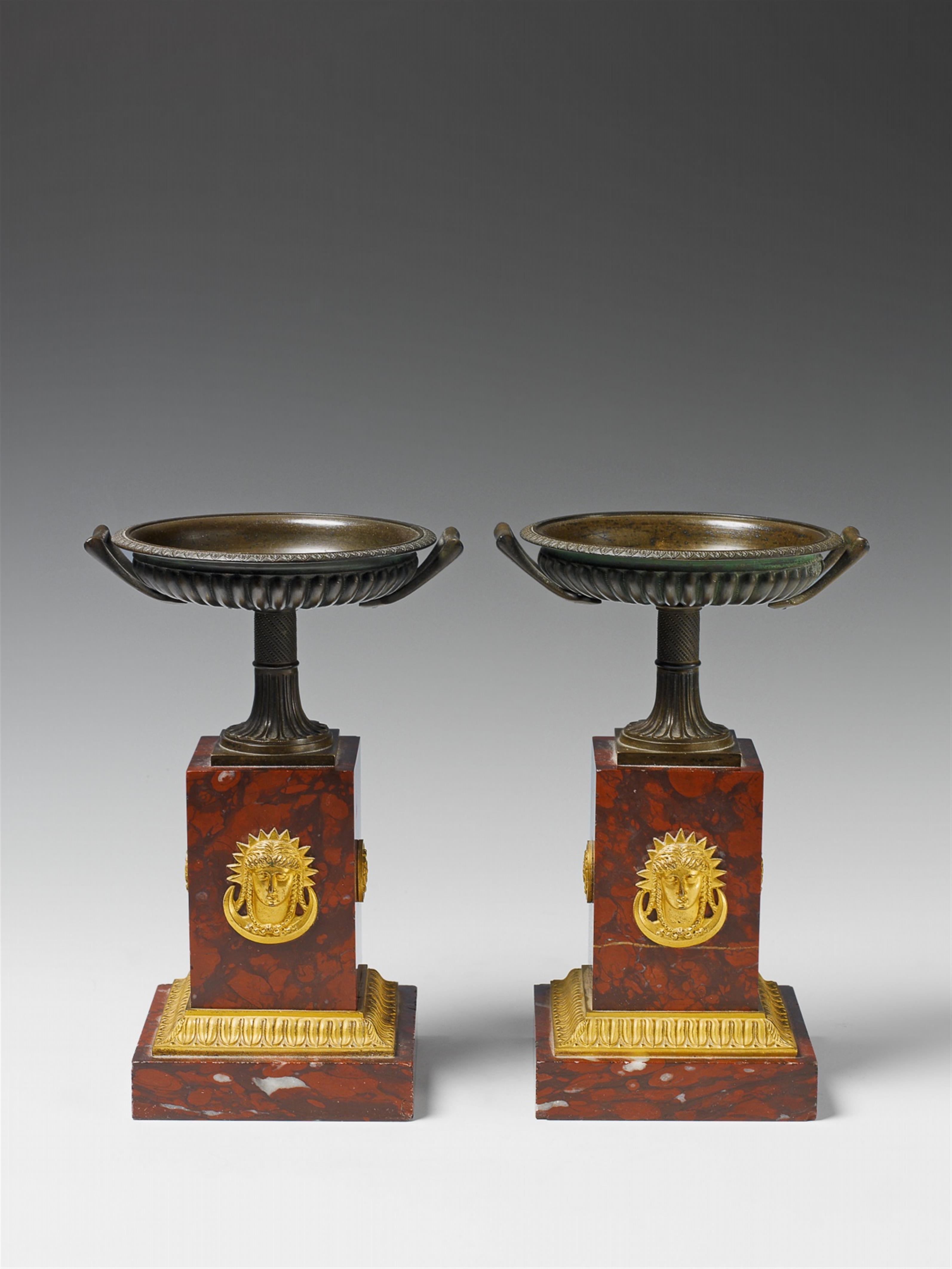 A pair of neoclassical bronze stembowls on red marble plinths. - image-1