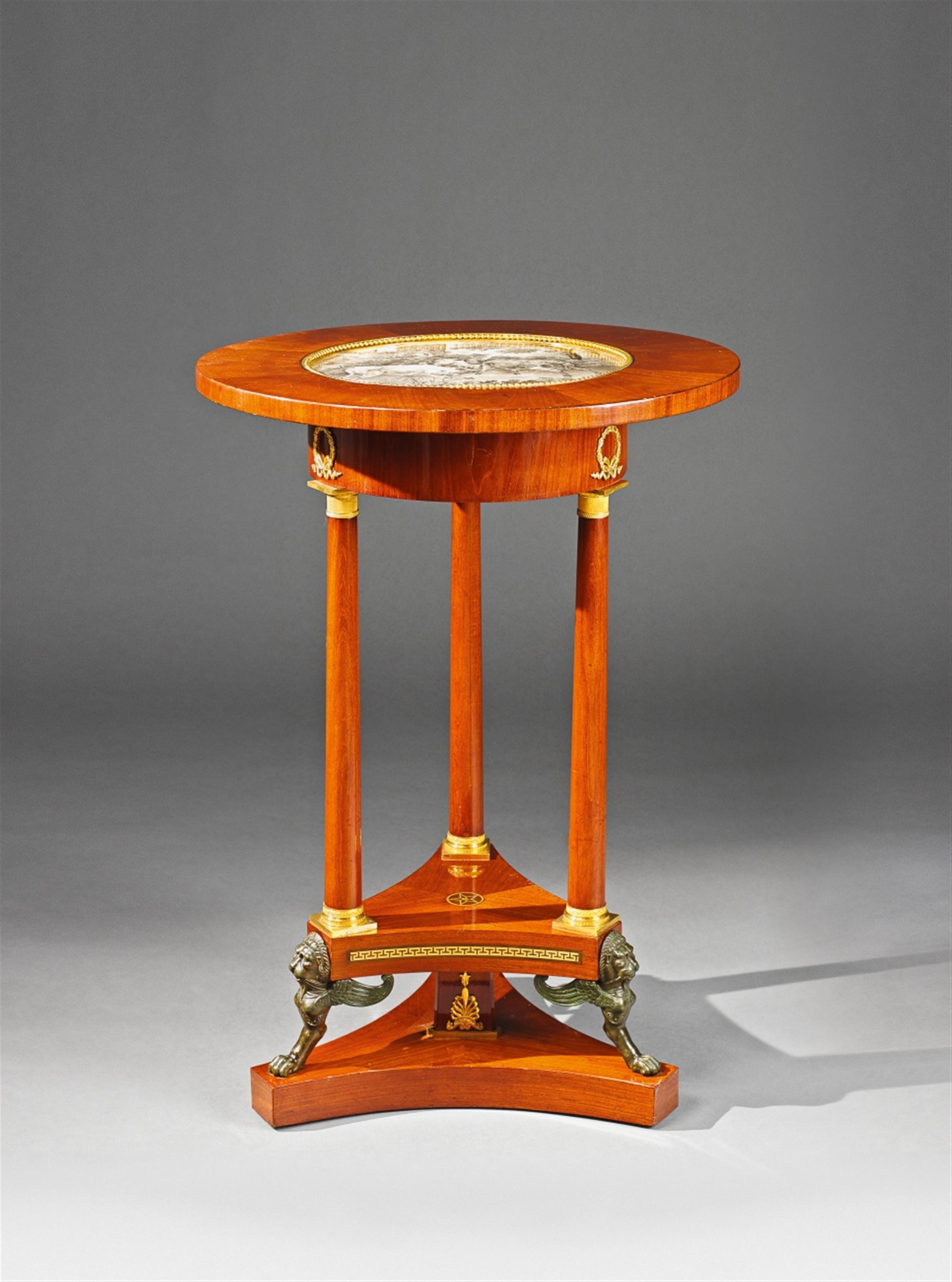 An ormolu mounted mahogany veneer courtly gueridon. - image-1