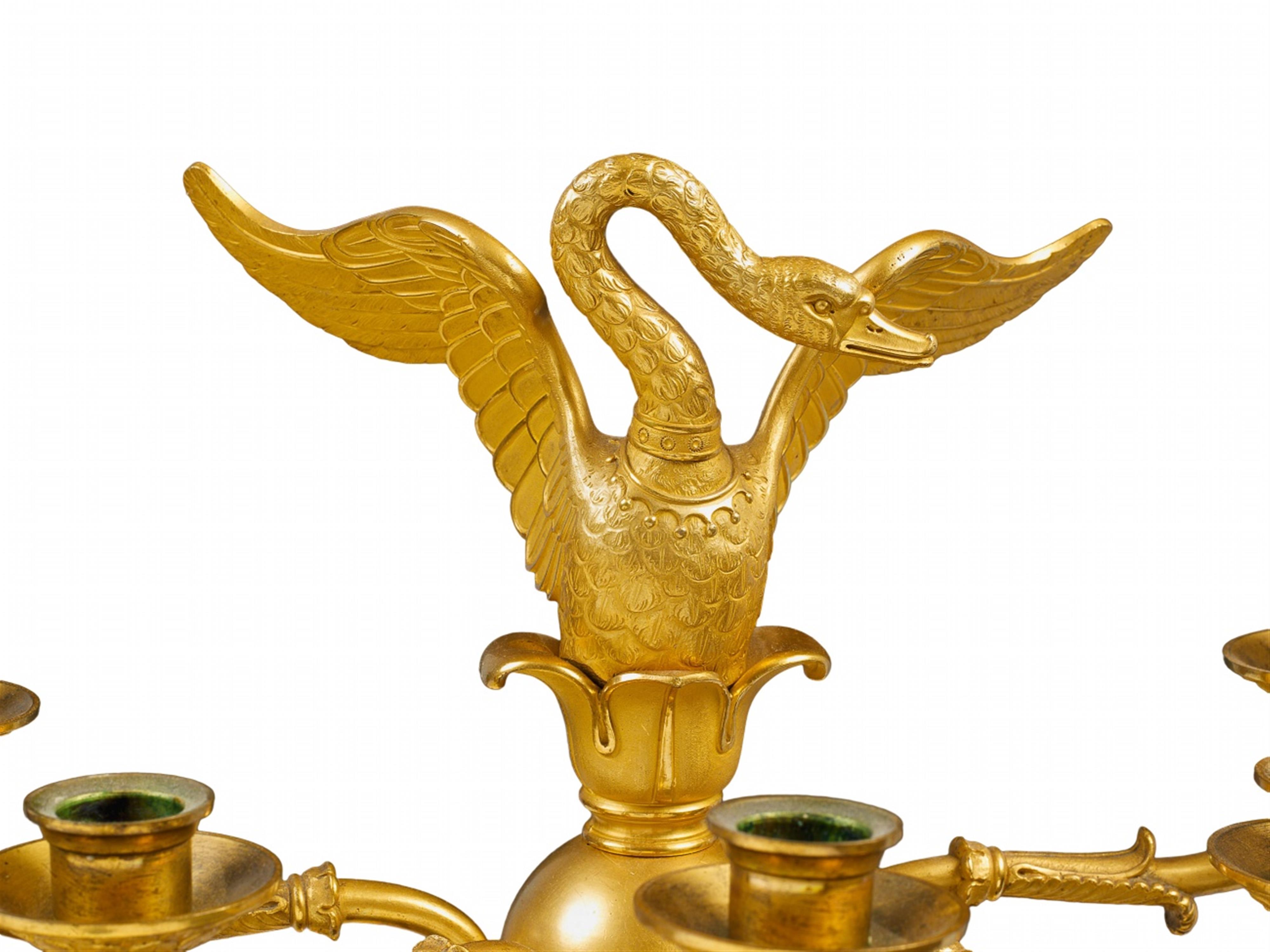 A pair of Parisian gilt bronze five-flame Empire candelabra with swan finials. - image-4