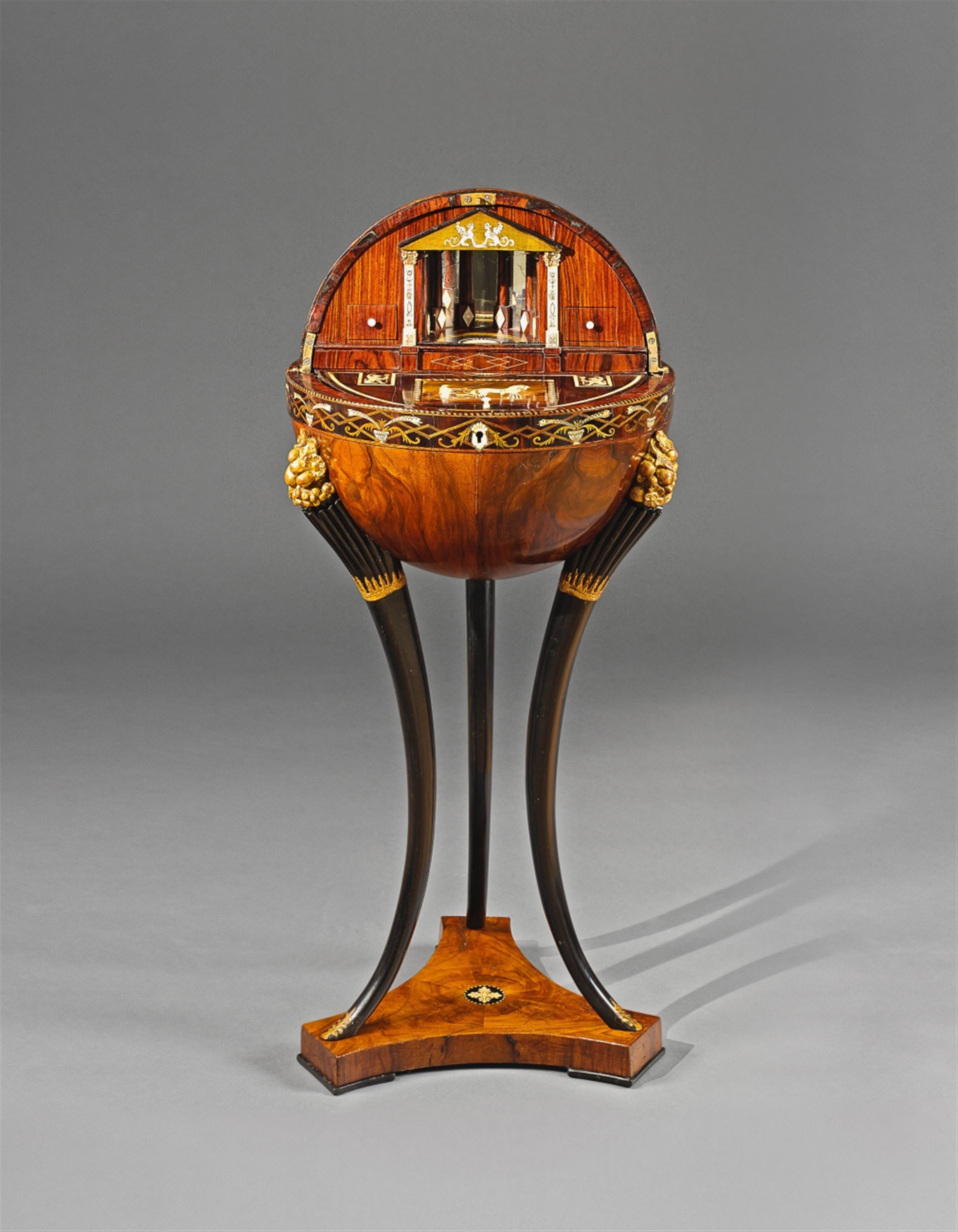 An inlaid walnut globe table. - image-1