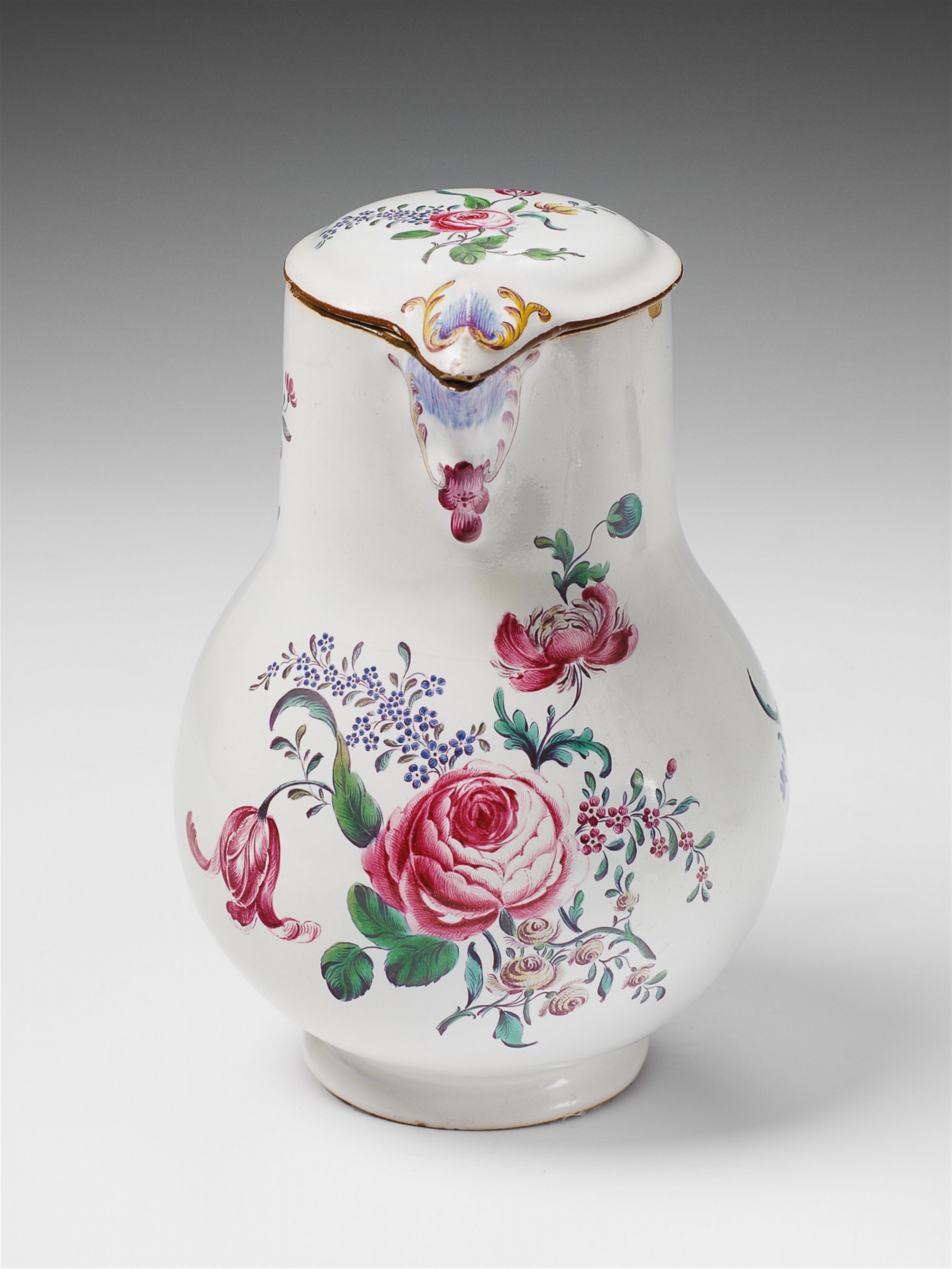 A Strasbourg faience pitcher with overglaze floral decor. - image-2