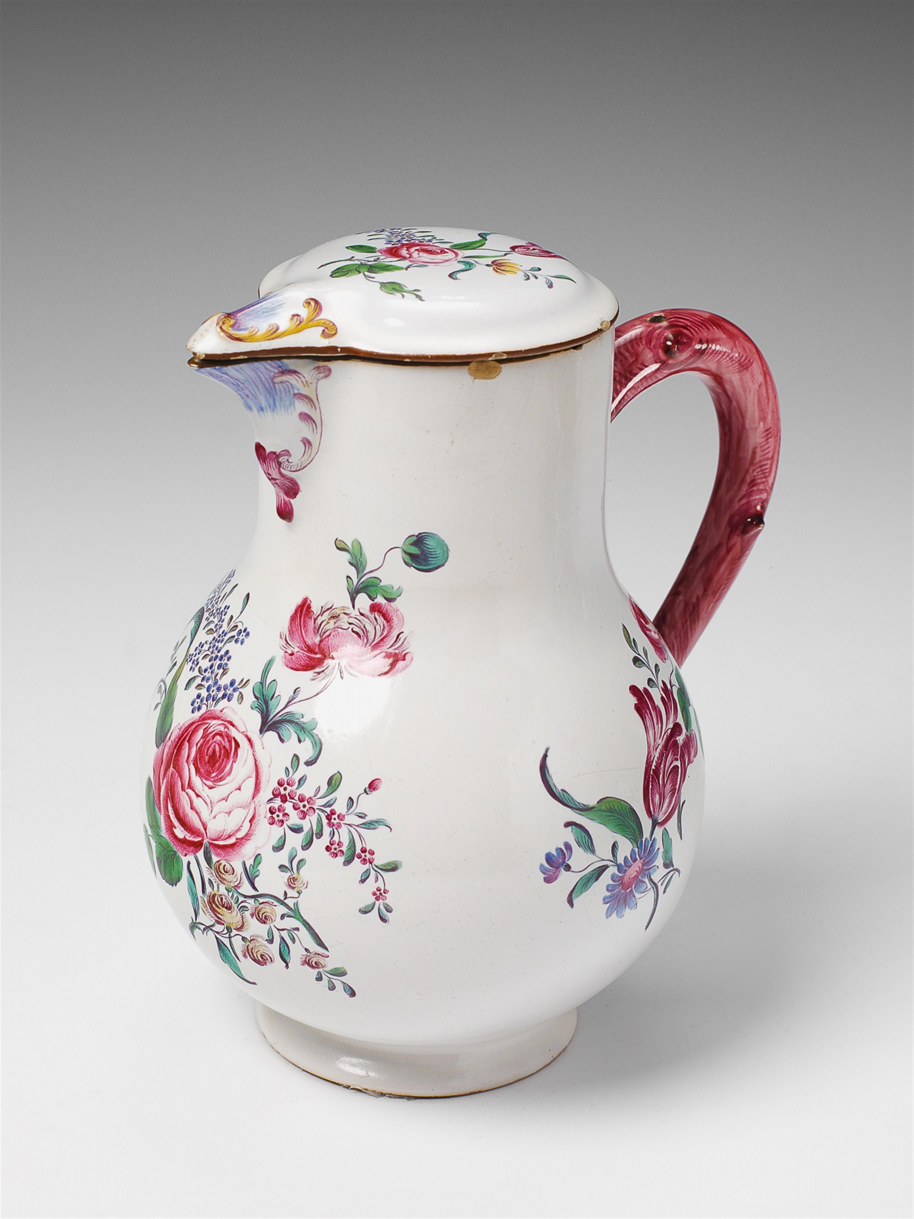 A Strasbourg faience pitcher with overglaze floral decor. - image-1